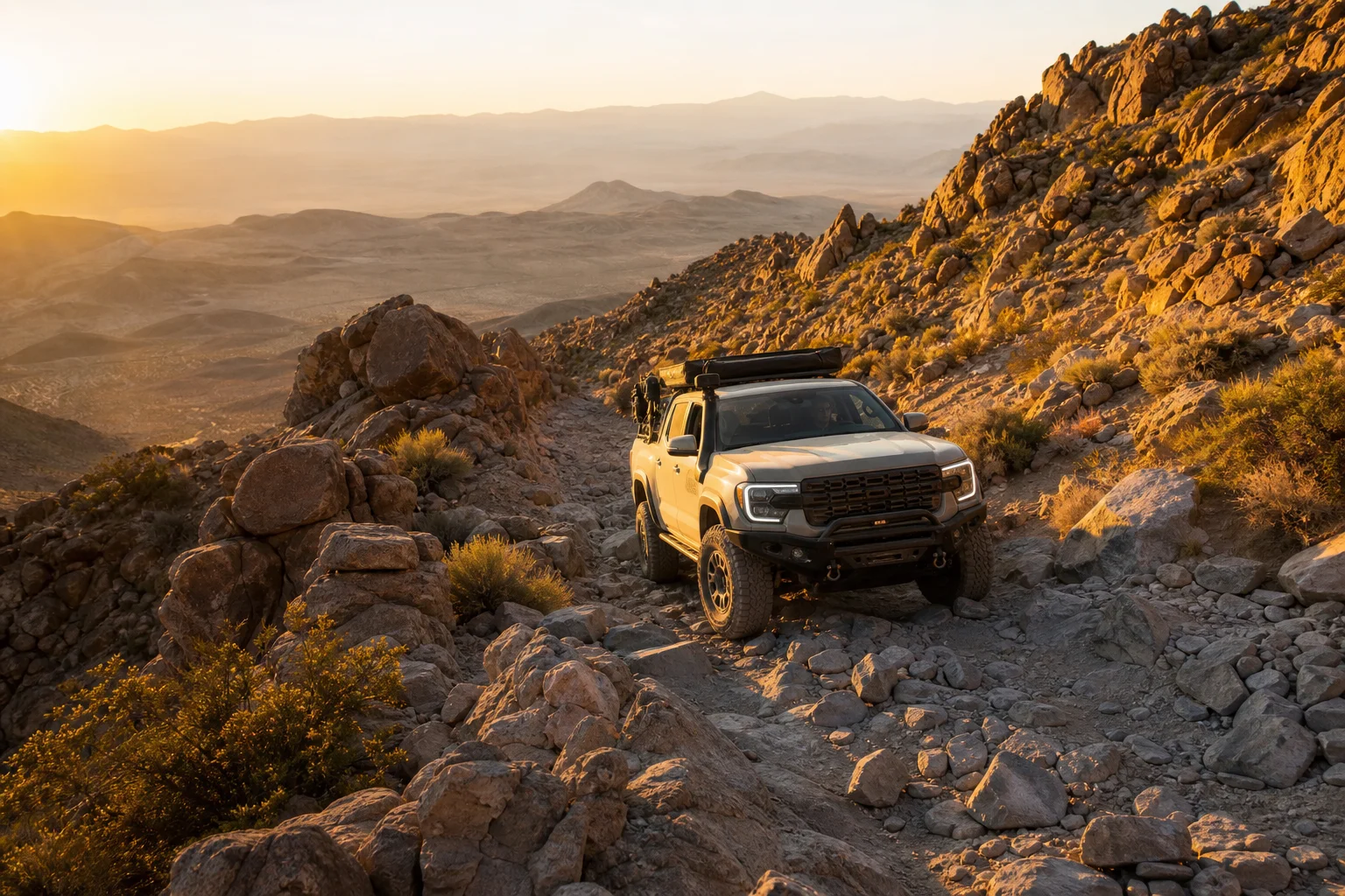 Off-road truck navigating rocky terrain with lowered tire pressure