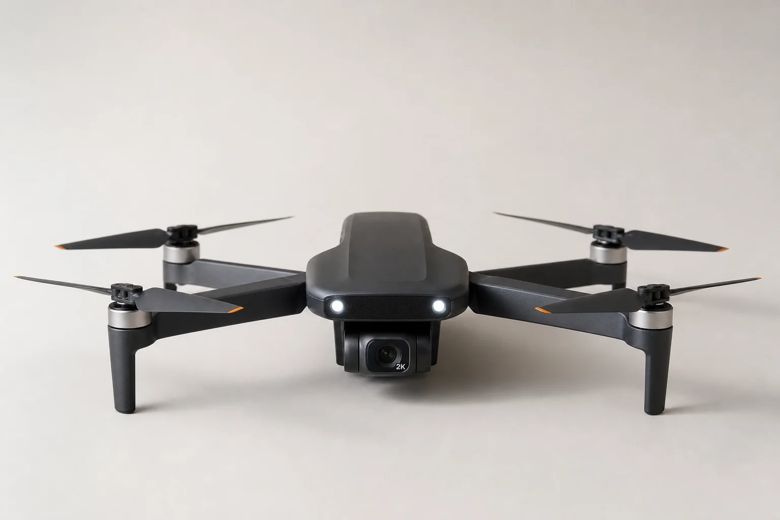 Five budget drones arranged on grey concrete surface