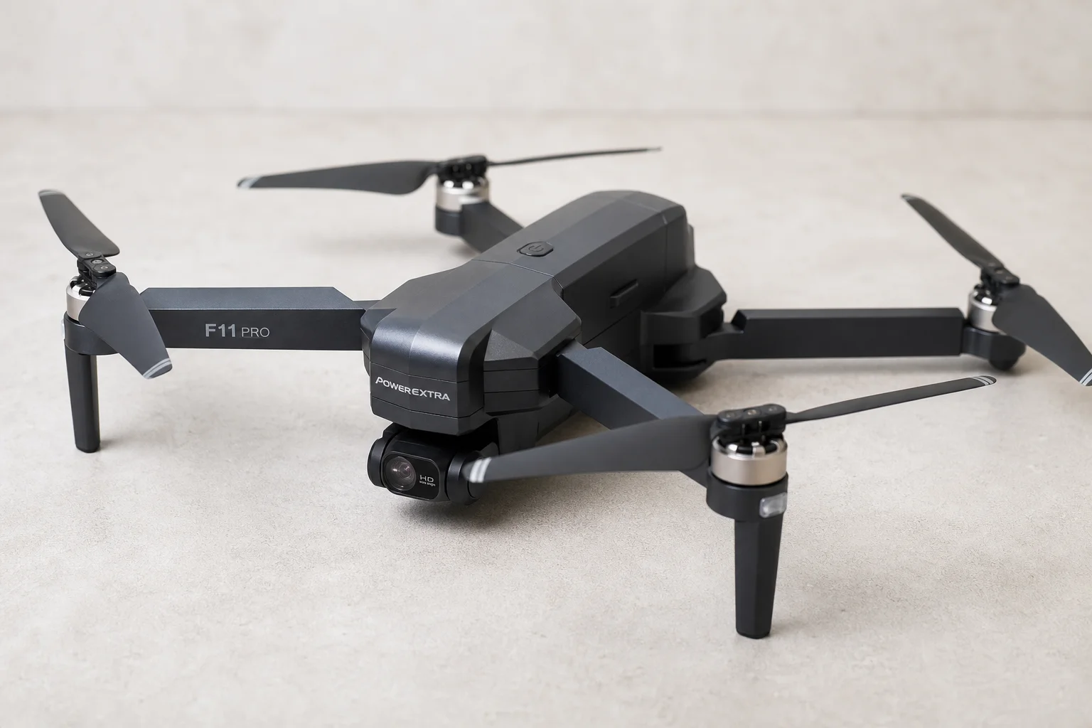 Six drones arranged by price tier on concrete surface