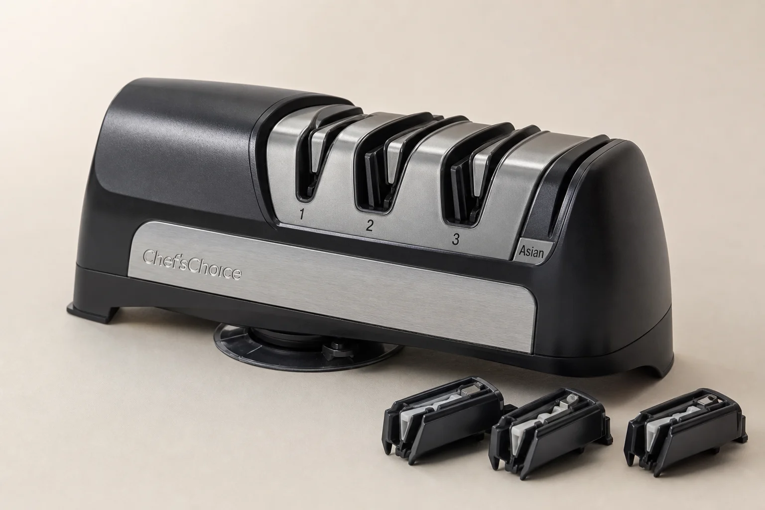 Five knife sharpeners arranged on concrete surface from manual to professional electric models