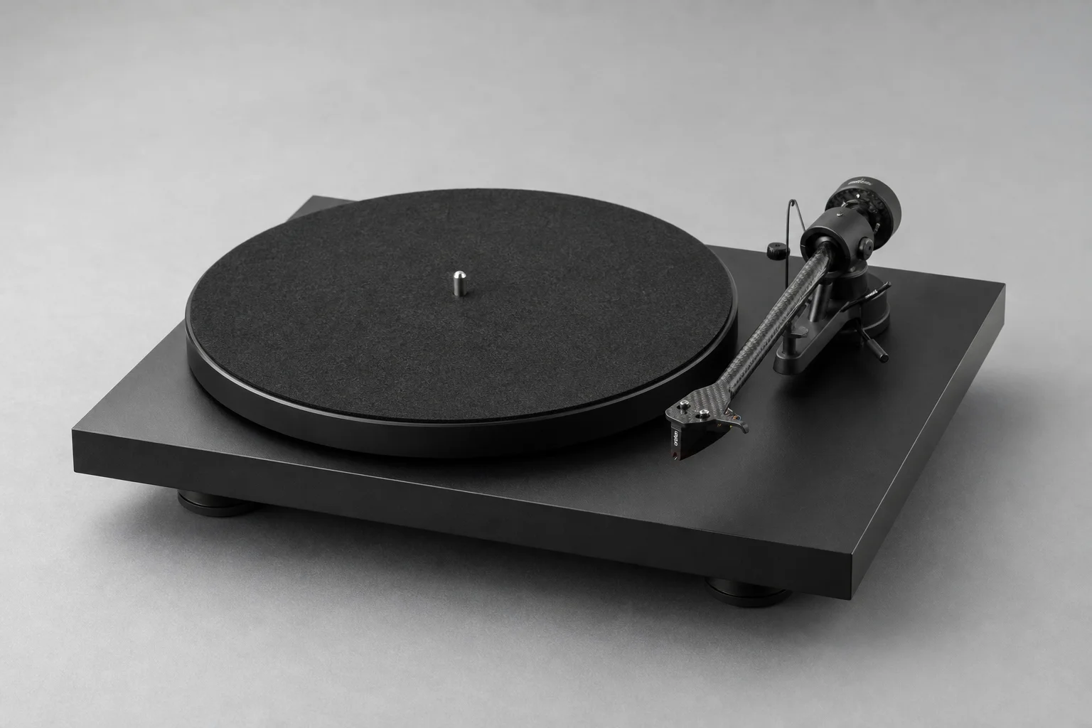Six turntables displayed on concrete surface showing variety of designs and finishes