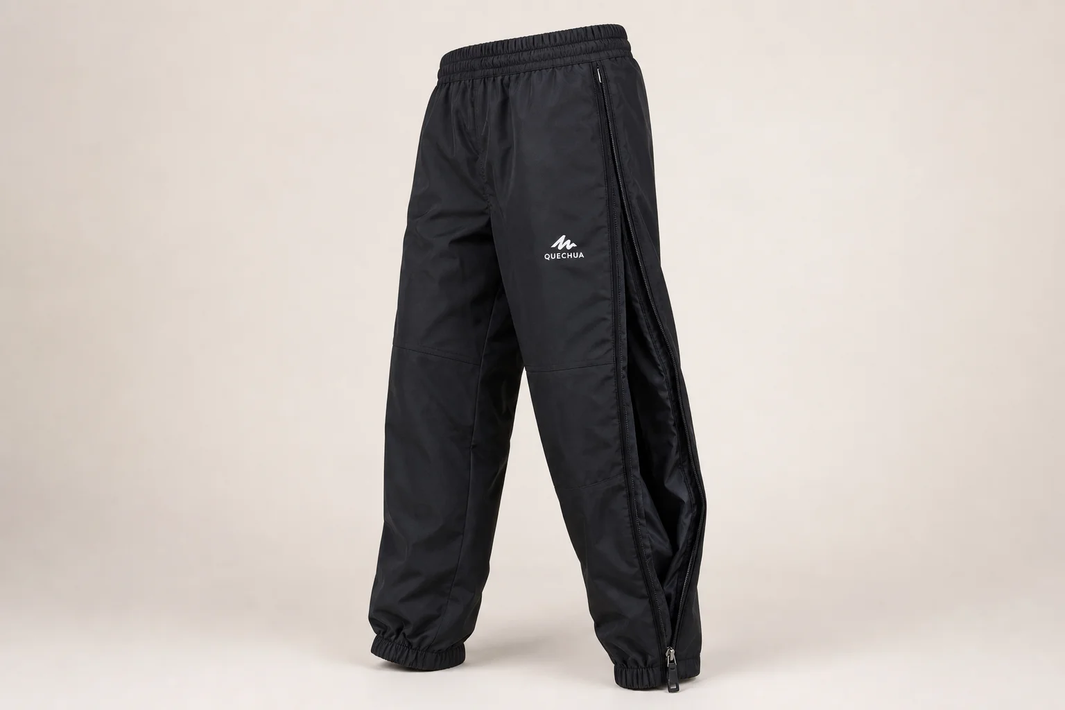 Five Decathlon rain jackets and pants displayed on neutral backdrop