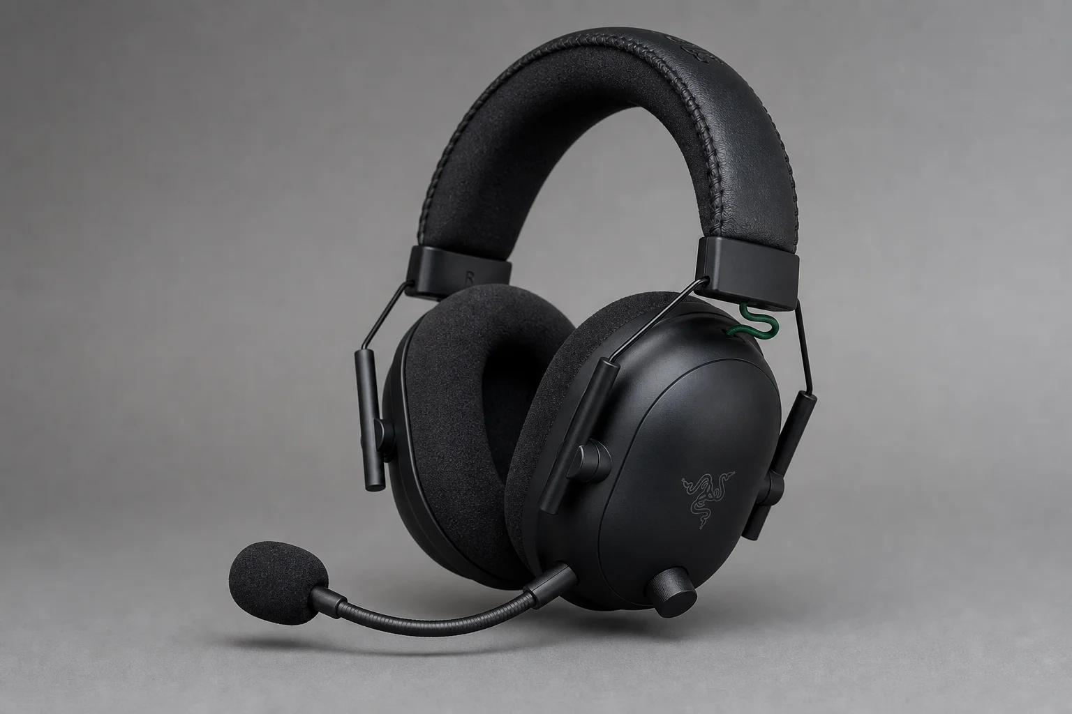Four gaming headsets displayed in a row on concrete surface