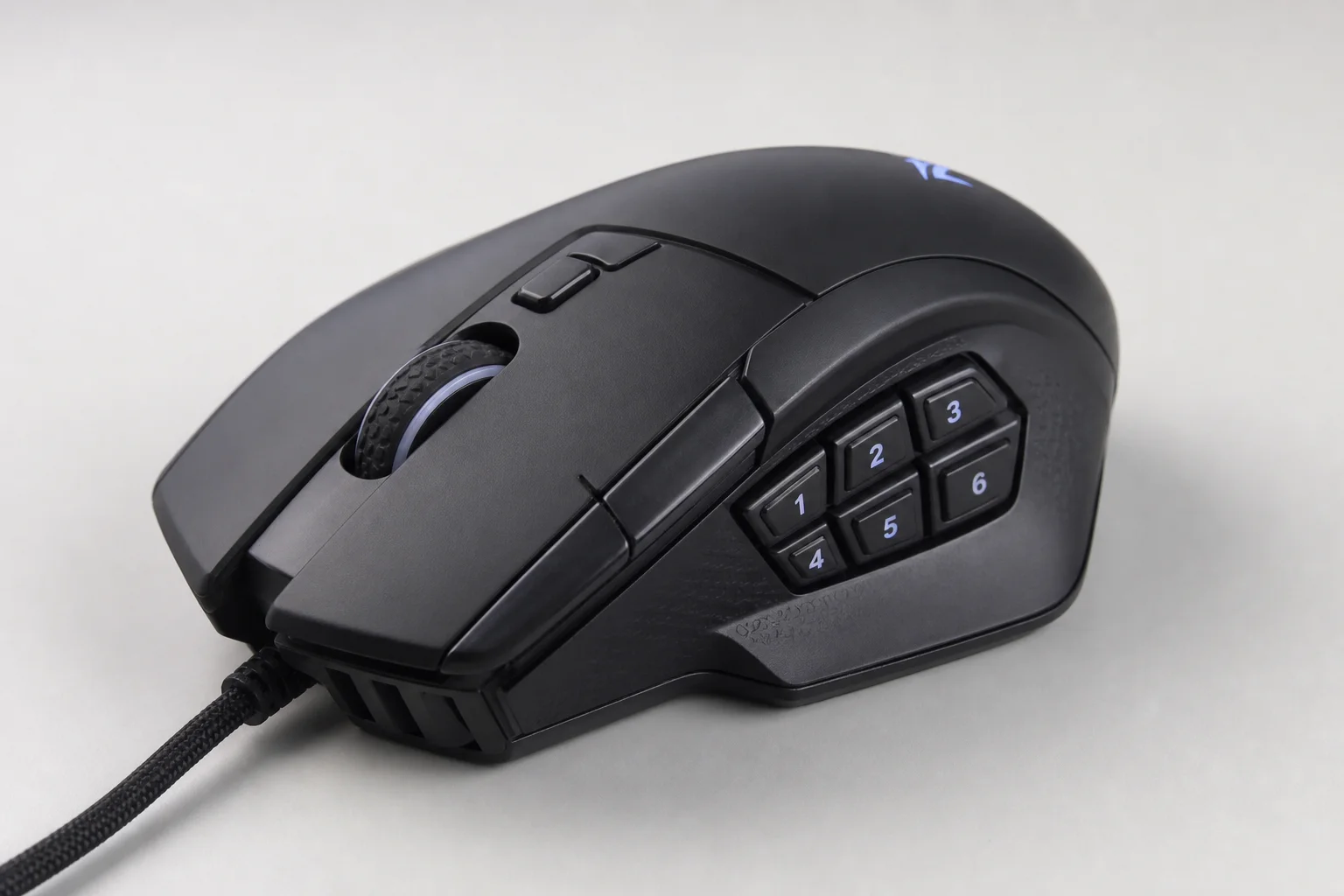 Five ergonomic mice in different styles arranged on a concrete surface