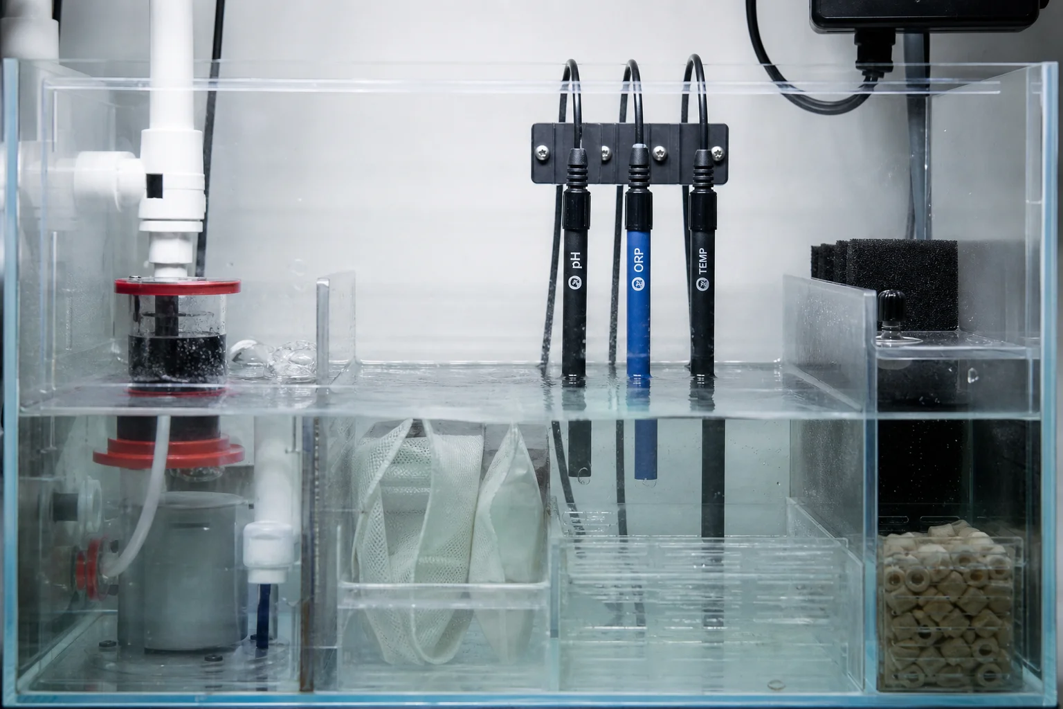 Aquarium sump with monitoring equipment installed