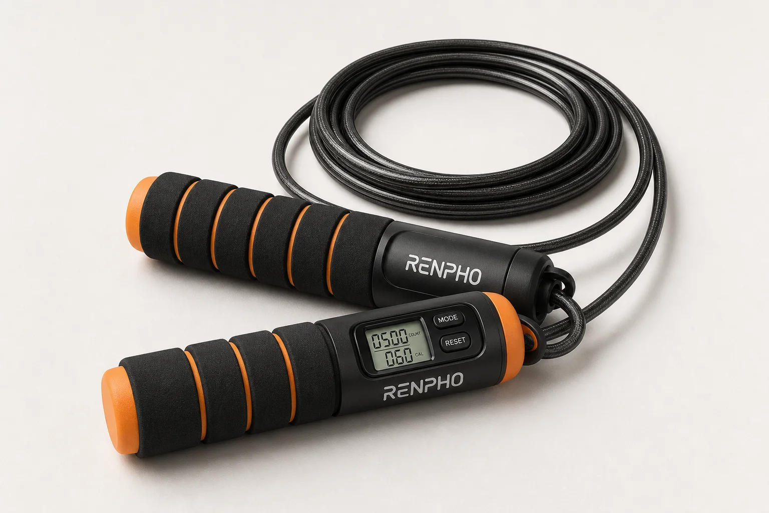 Five smart jump ropes with different handle colors and designs arranged on concrete