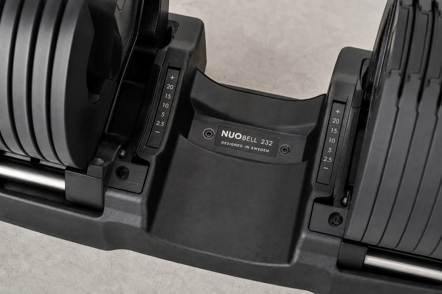 Close-up of adjustable dumbbell cradle seating mechanism