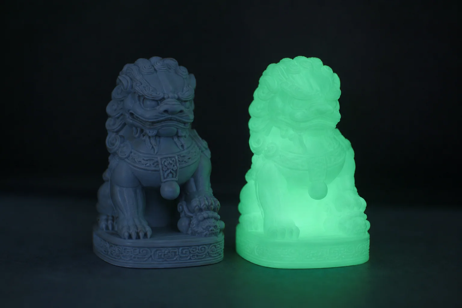 Glow-in-the-dark 3D-printed object glowing in darkness next to original