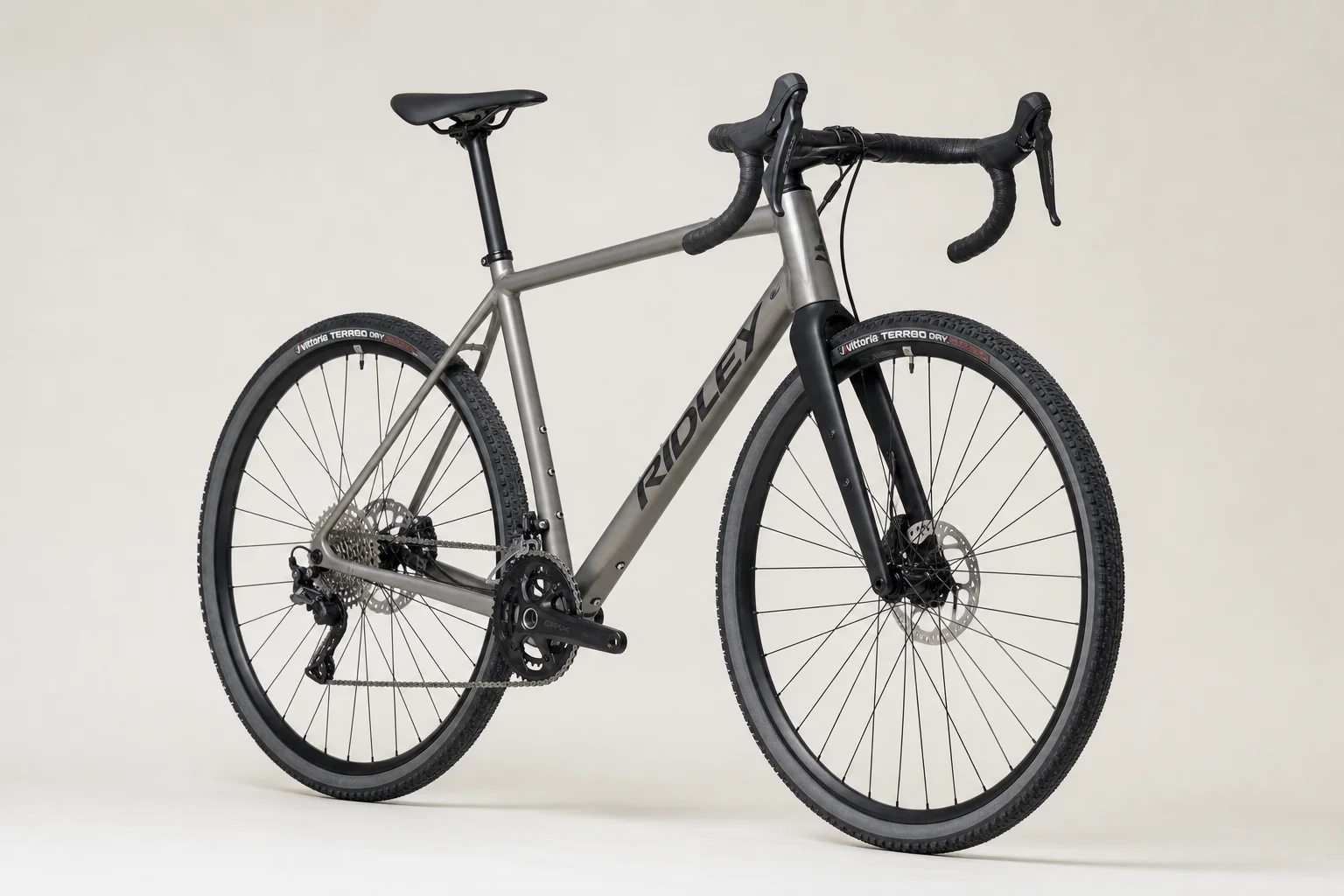 Multiple allroad bikes displayed on neutral backdrop showing different frame materials and designs