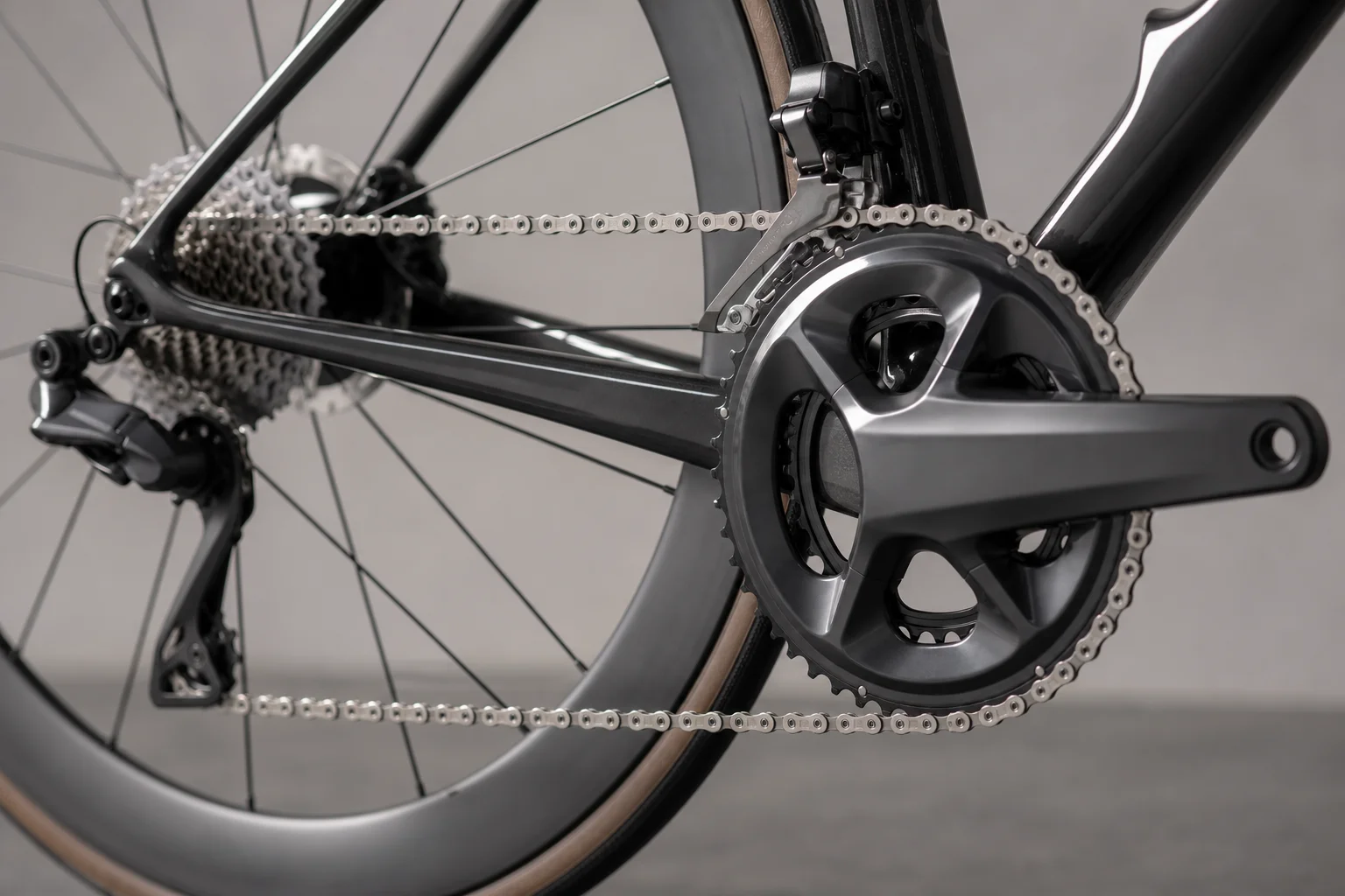 Close-up of road bike drivetrain showing dual chainrings and cassette