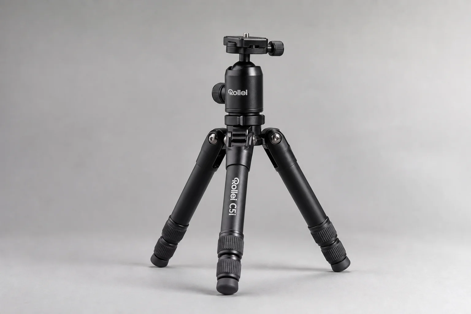 Sony A6400 mirrorless camera with attached zoom lens on brushed aluminium surface
