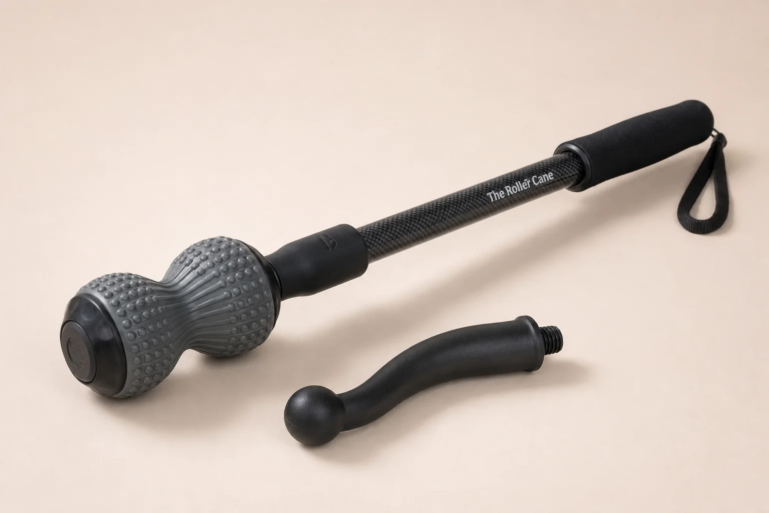 Roller Cane with massage ball and detachable cane attachment on neutral backdrop