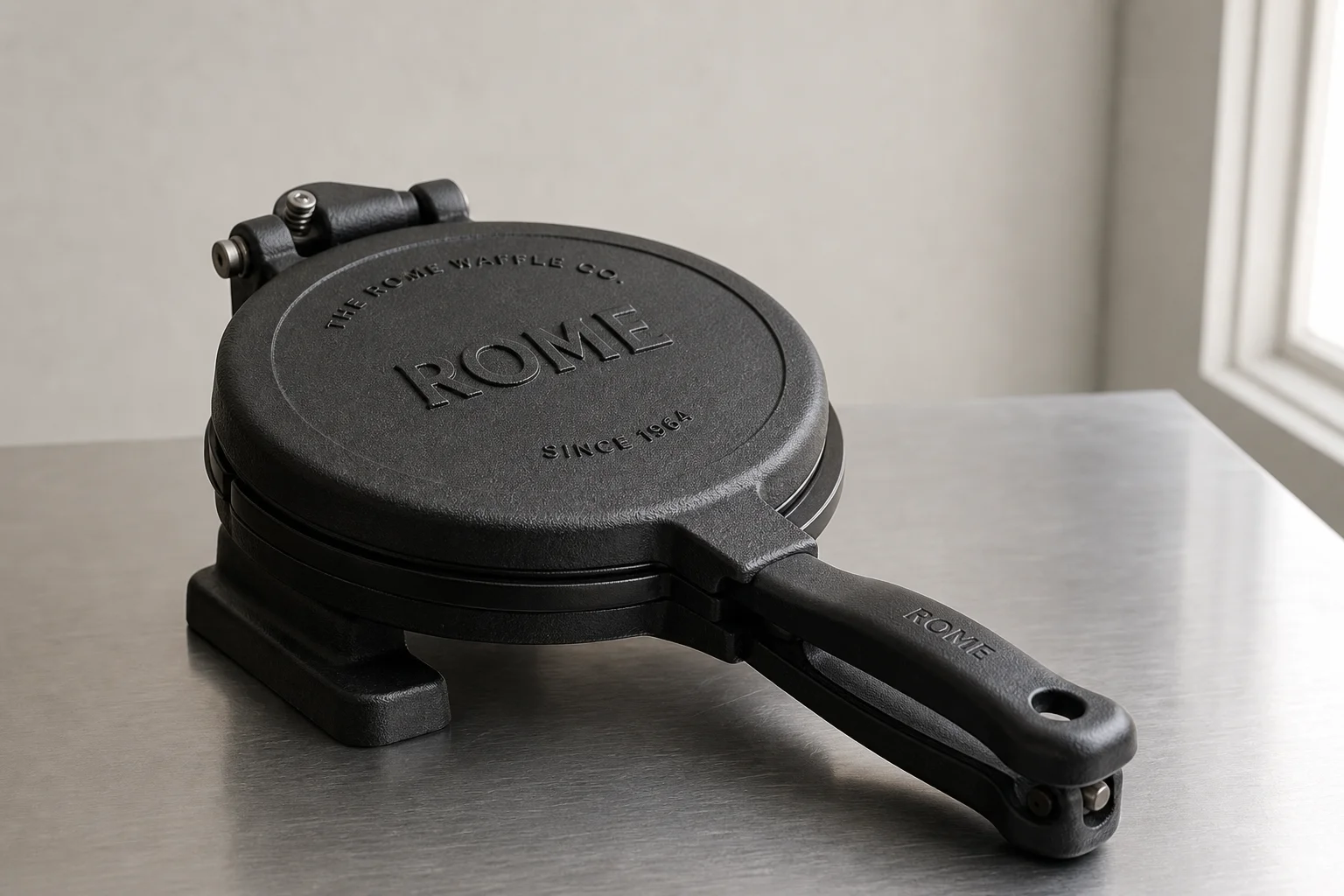 Five non-toxic waffle makers arranged on concrete surface