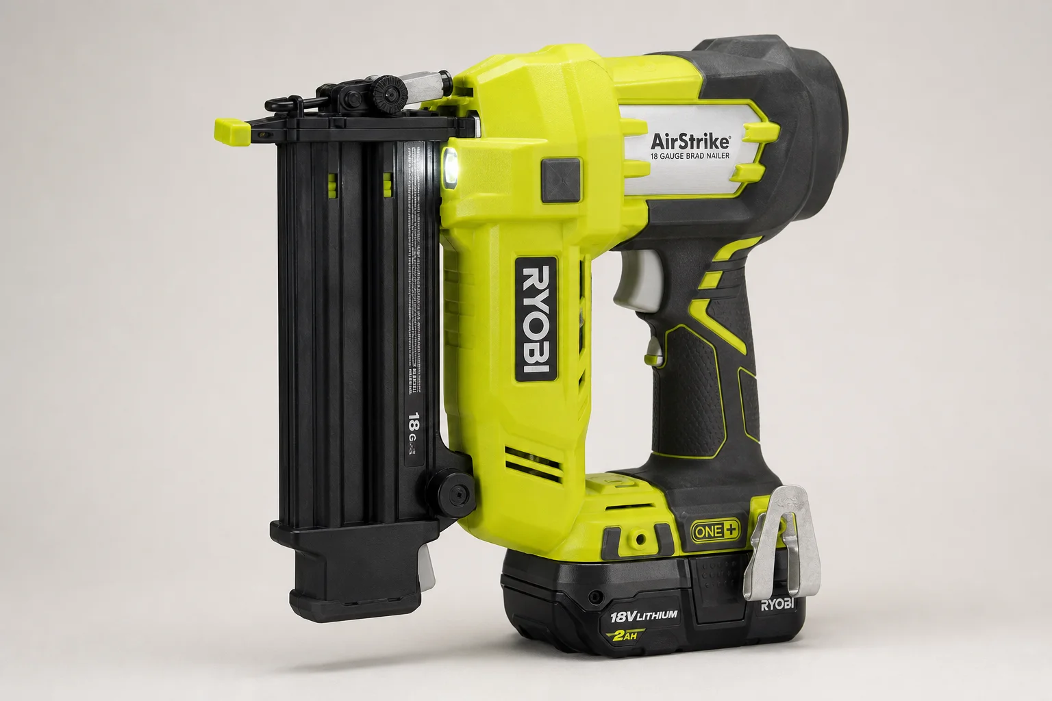 Ryobi 18V One+ cordless tools arranged on concrete surface