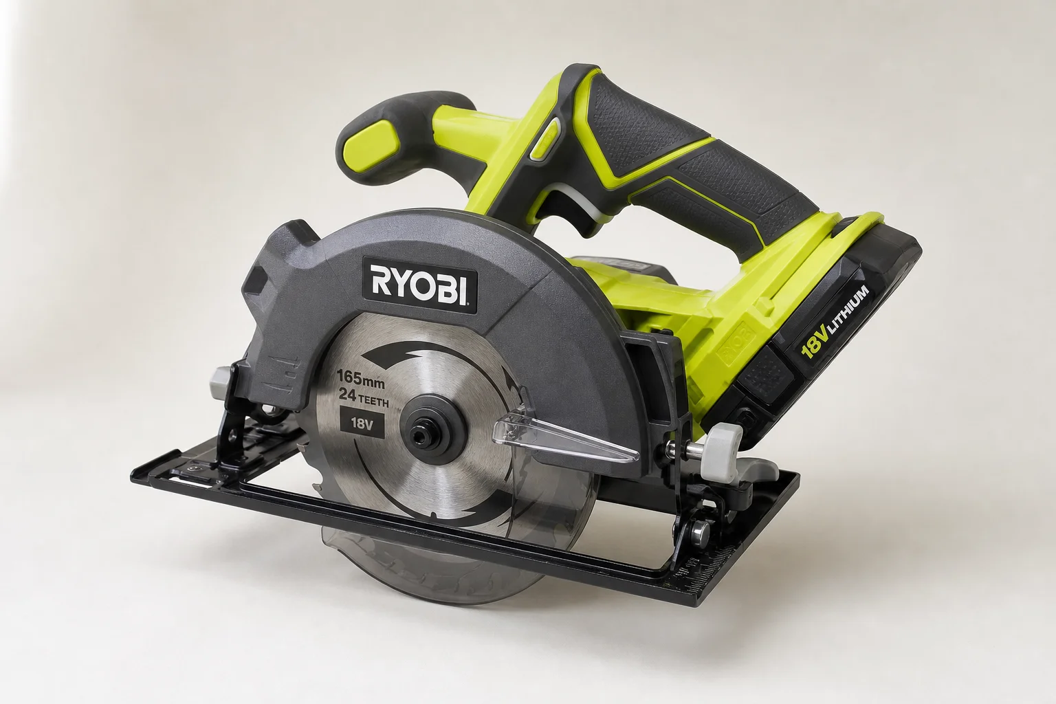 Ryobi 18V One+ cordless tools arranged on concrete surface
