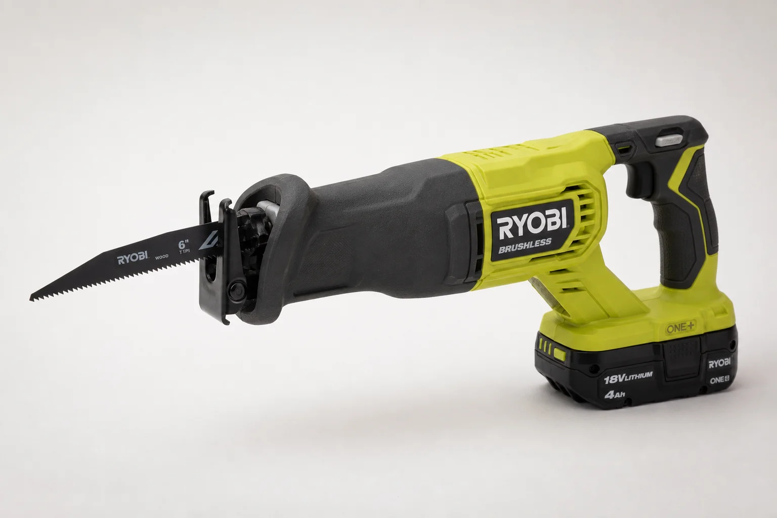 Ryobi 18V One+ cordless tools arranged on concrete surface