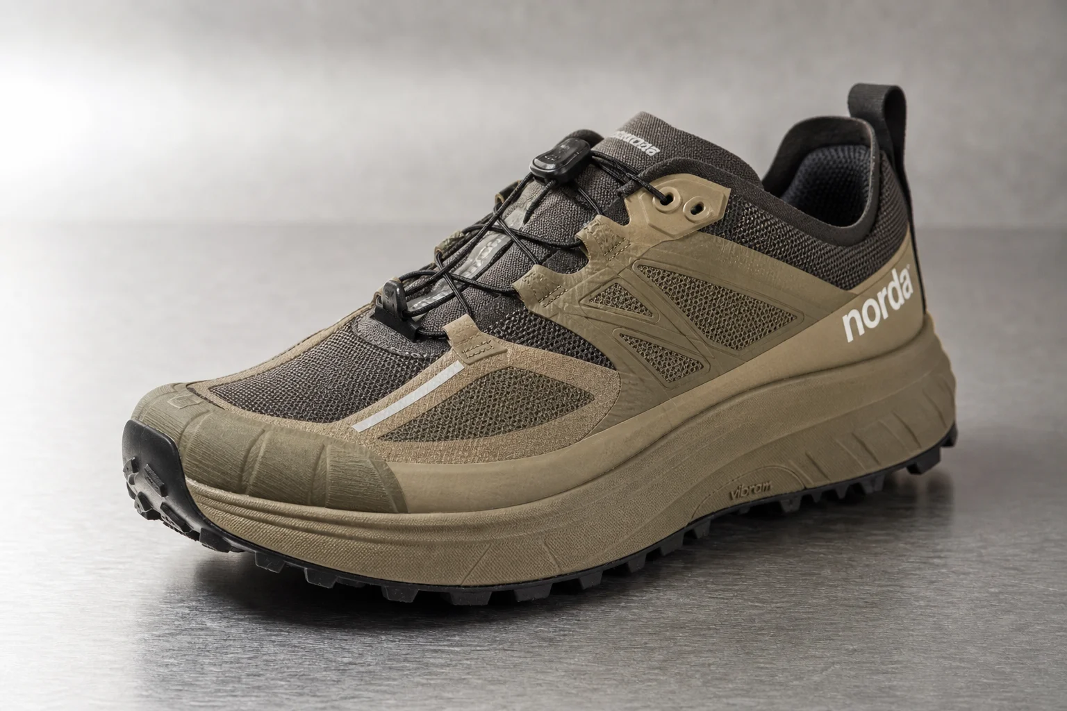 Three wide toe box trail running shoes on concrete surface