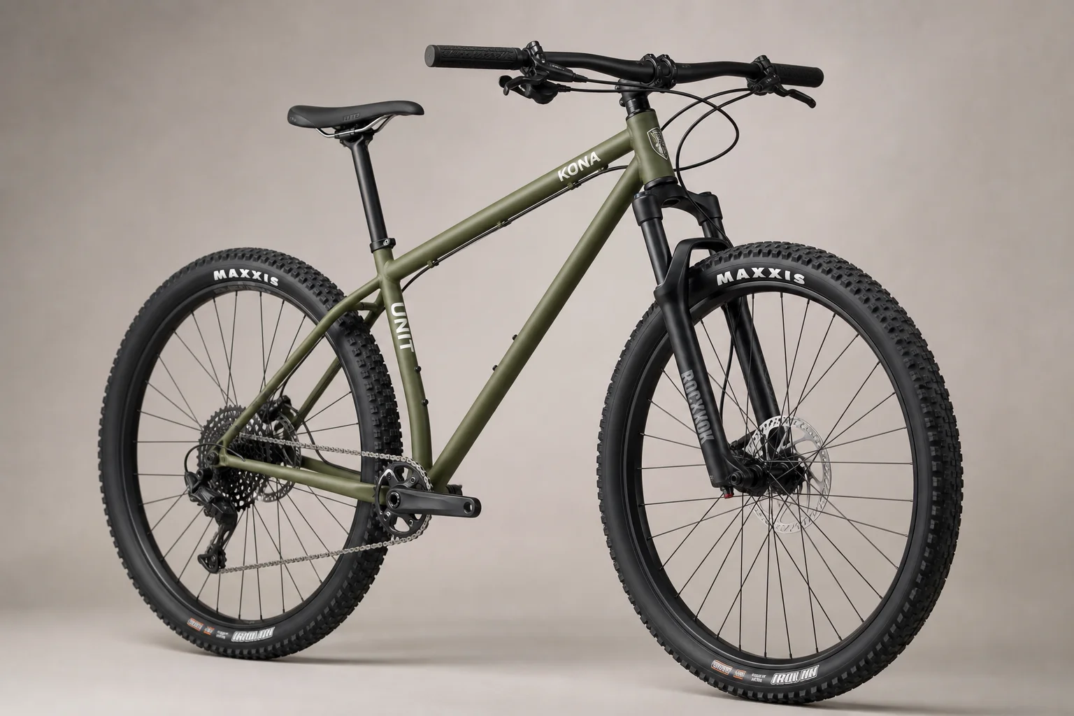 Fully loaded hardtail mountain bike with bikepacking gear on neutral backdrop