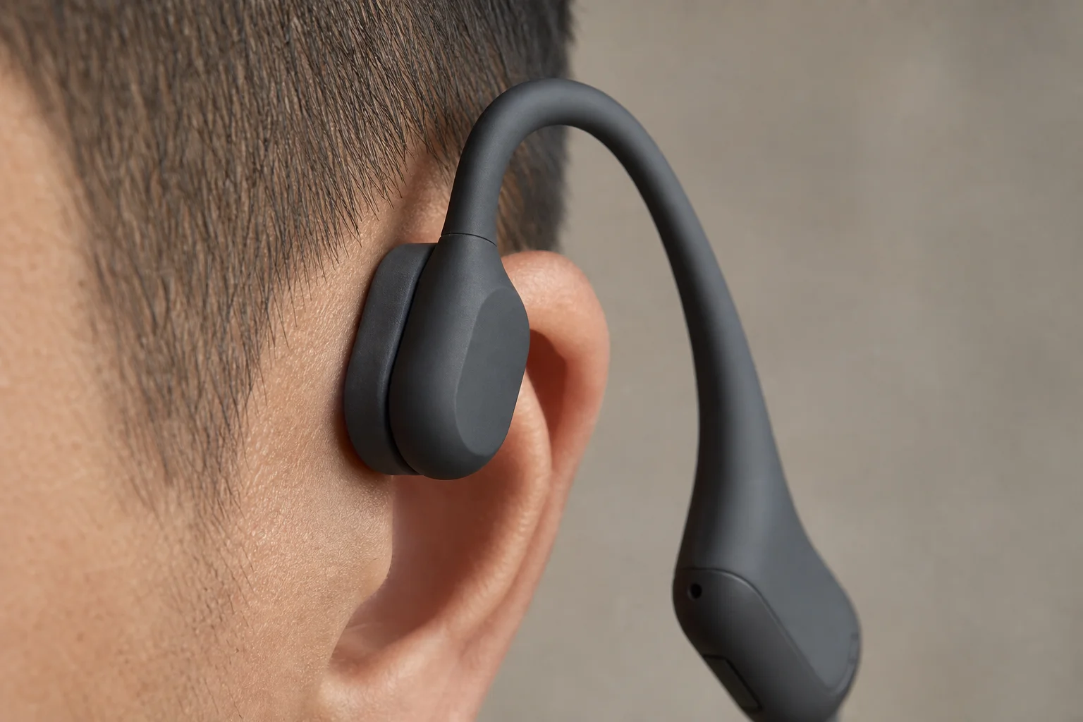 Close-up of bone conduction headphone silicon pads on side of head