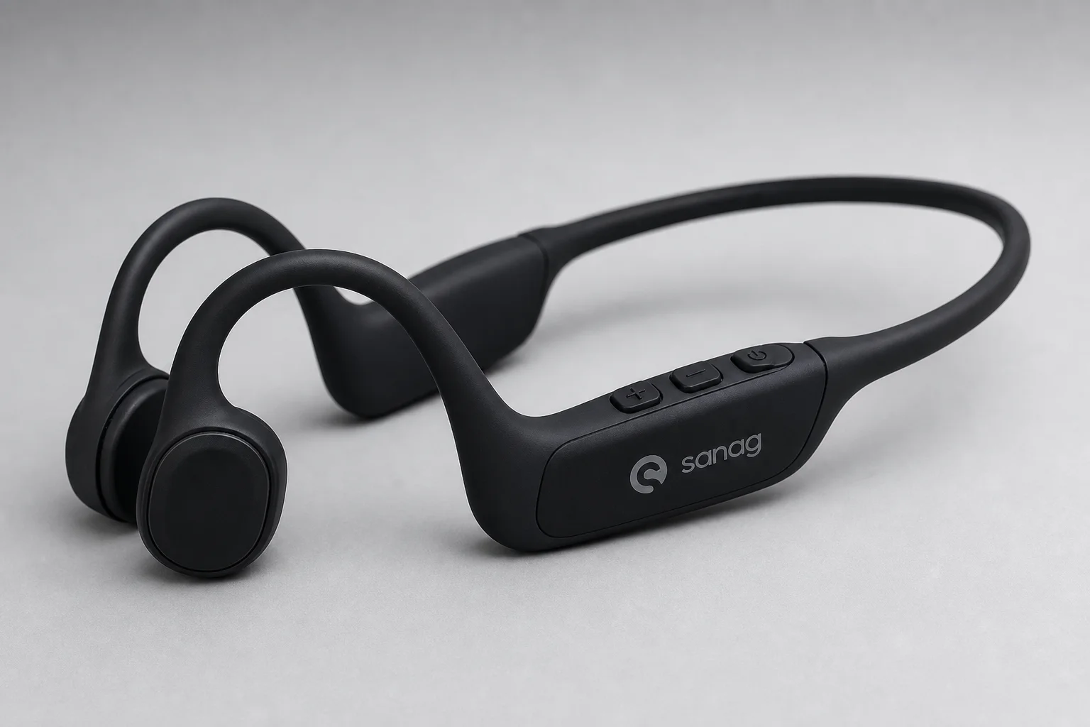 Sanag A5X and Shokz OpenMove bone conduction headphones on concrete surface