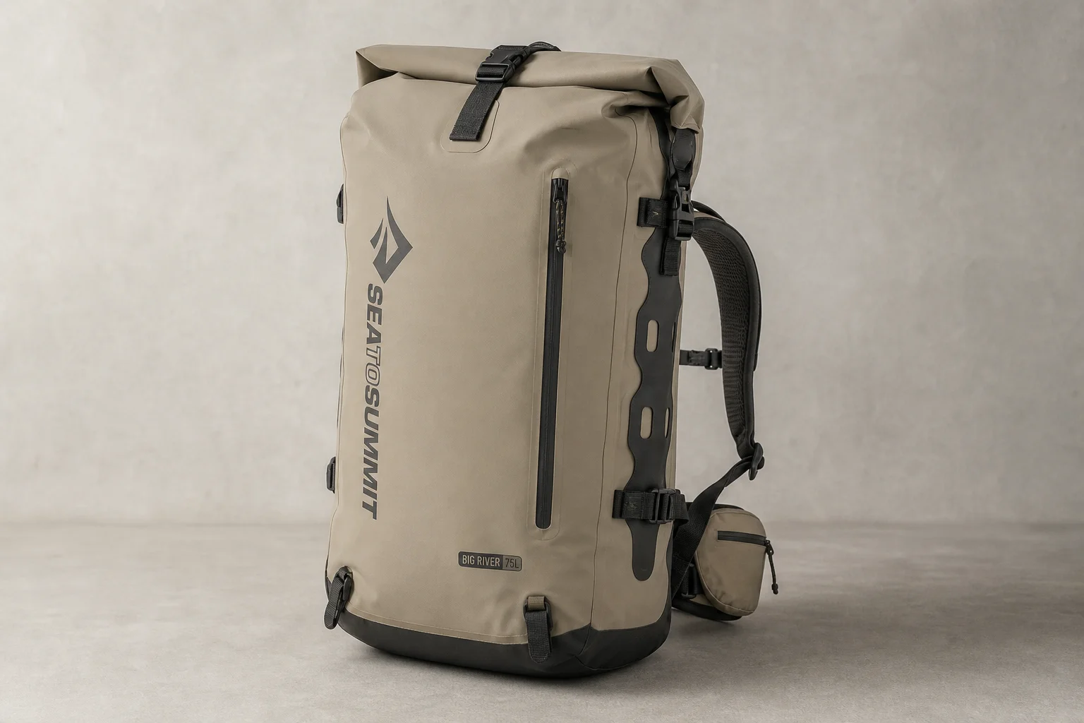 Sea to Summit Big River Dry Backpack 75L on neutral surface showing roll-top closure and harness