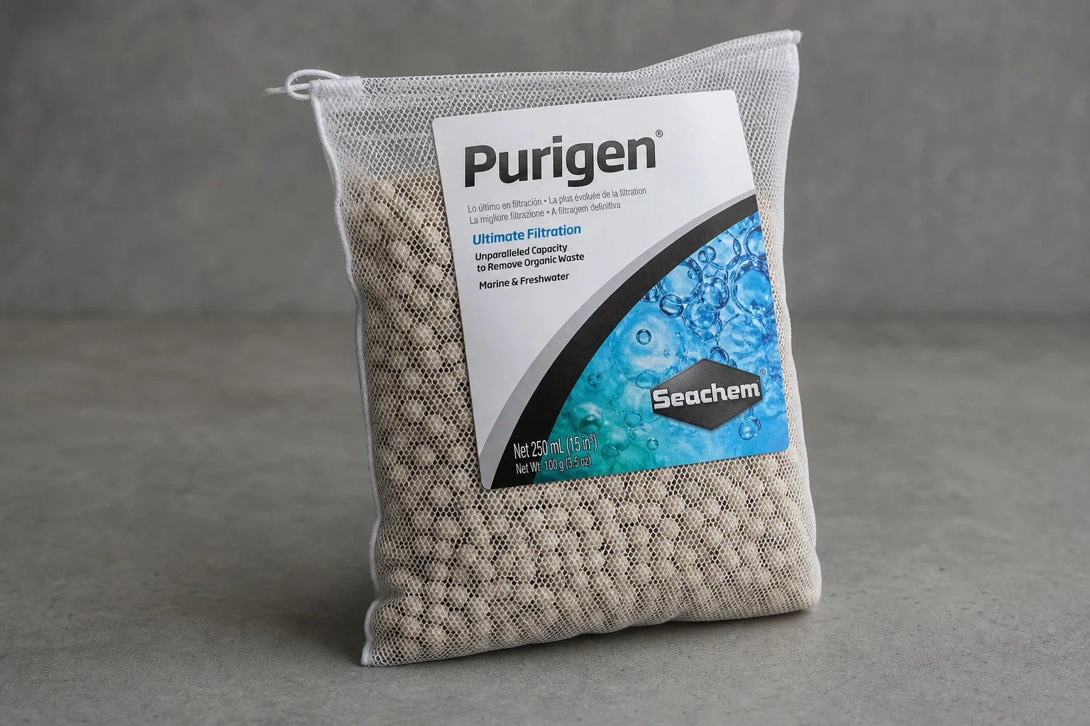 Fluval FX6 canister filter with visible internal media trays on grey surface