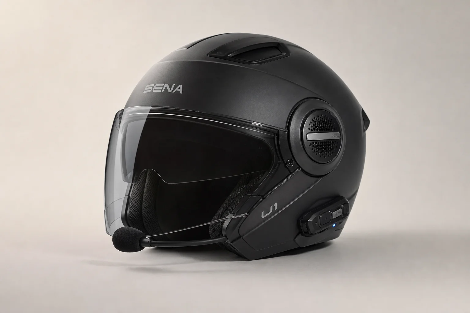Sena U1 communication helmet in matte black with visor on neutral background