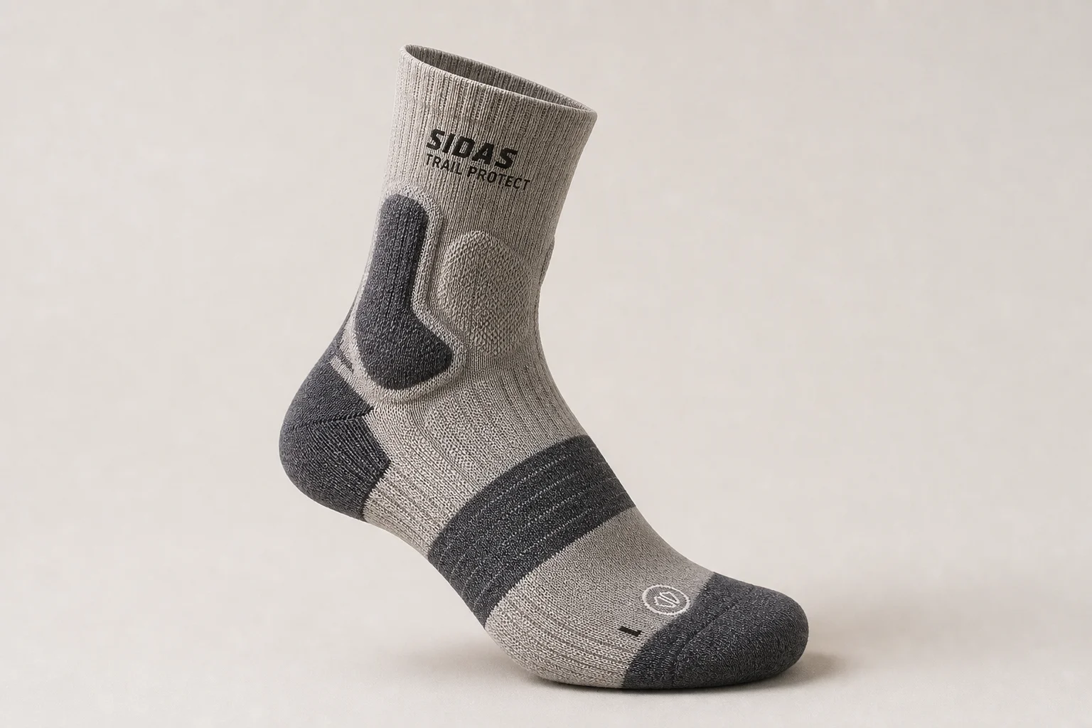 Collection of running socks in various colors and styles arranged on concrete surface