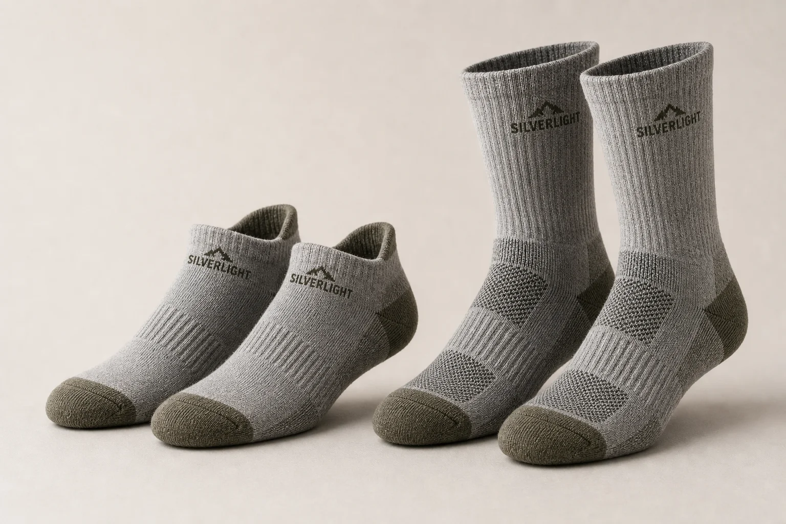Silverlight hiking socks in ankle and crew styles on neutral backdrop