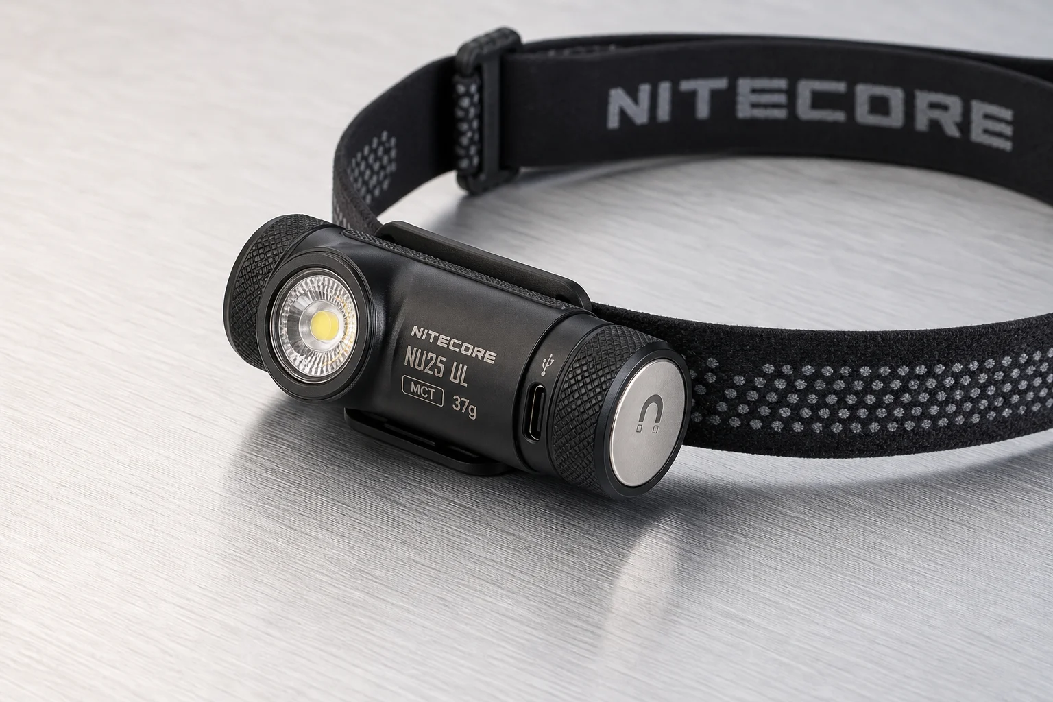Five headlamps displayed on concrete surface showing range from compact to professional models