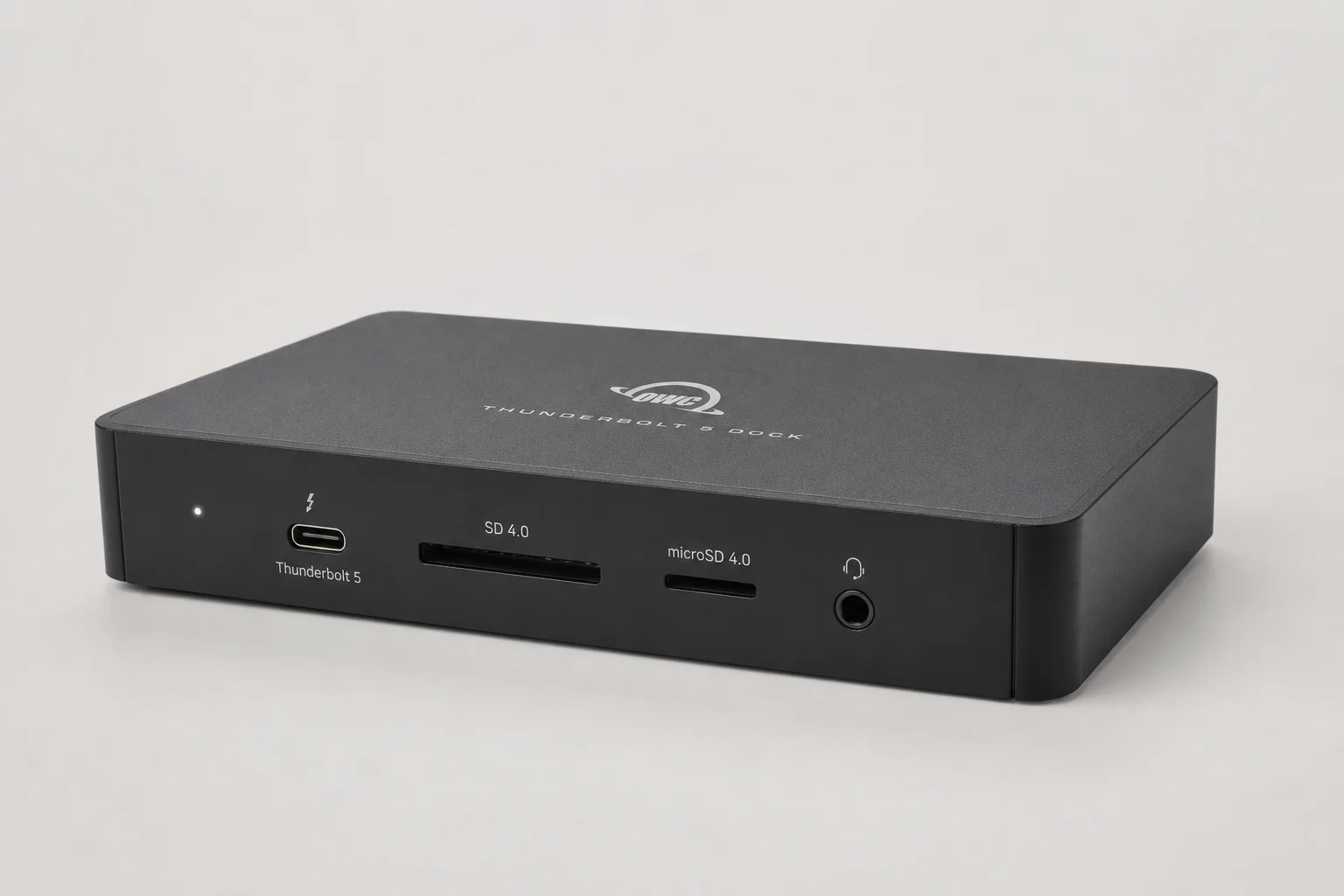 Six Thunderbolt 5 docking stations displayed on concrete surface