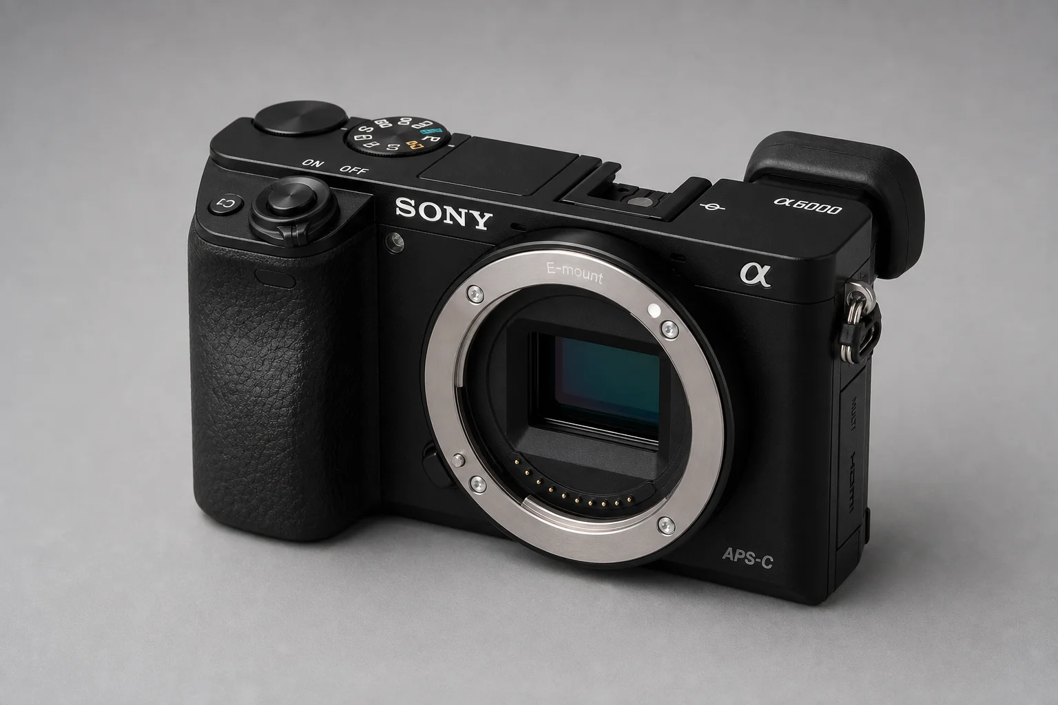 Three Sony mirrorless cameras with lenses arranged on concrete surface
