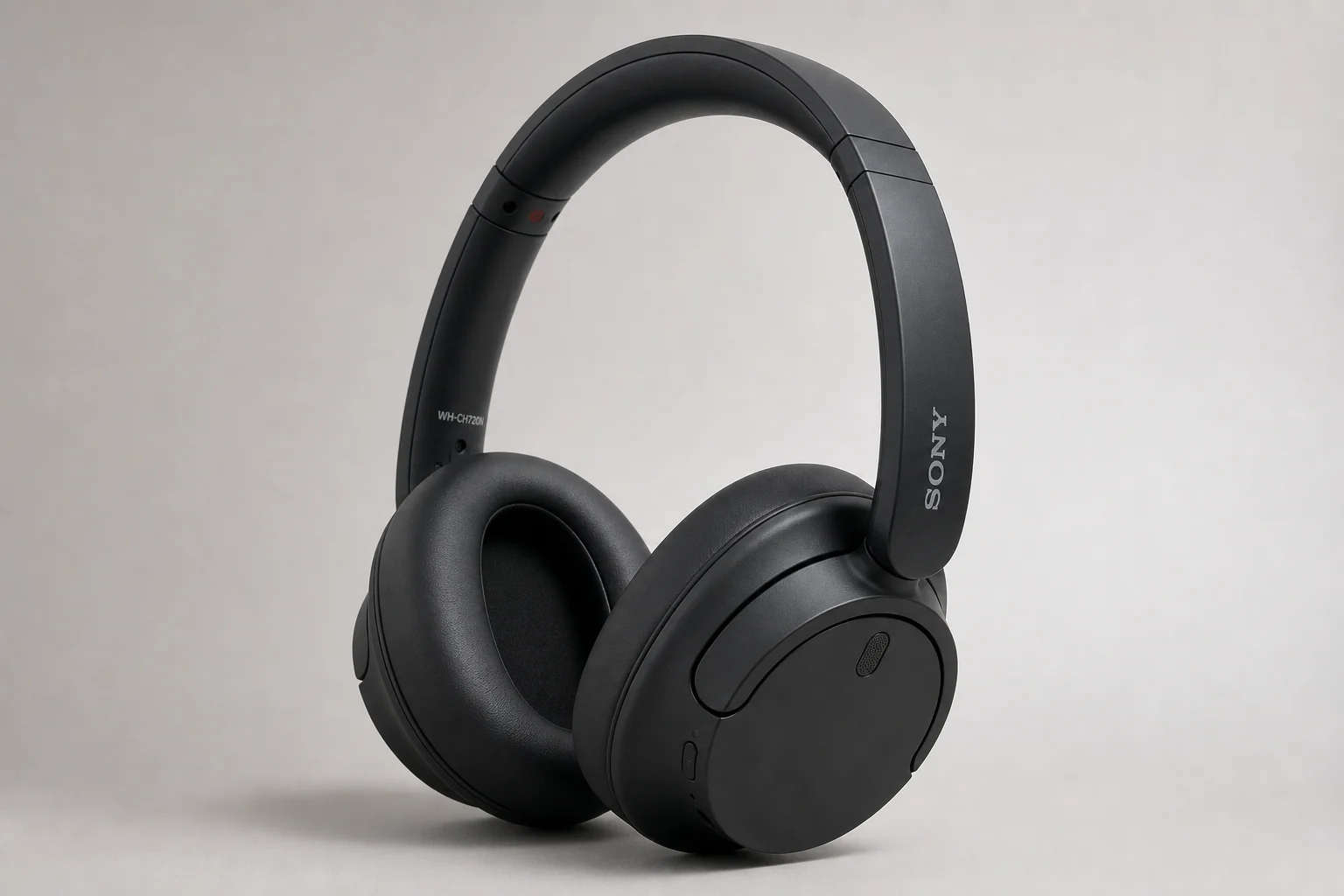 Three Sony headphone models arranged by price tier on concrete surface