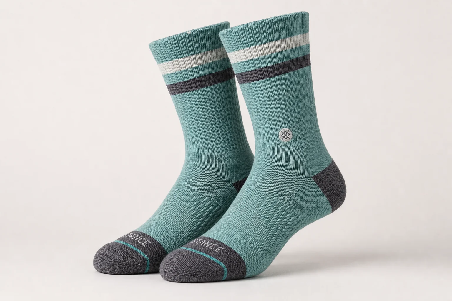 Collection of various running socks in different colors and styles on neutral backdrop