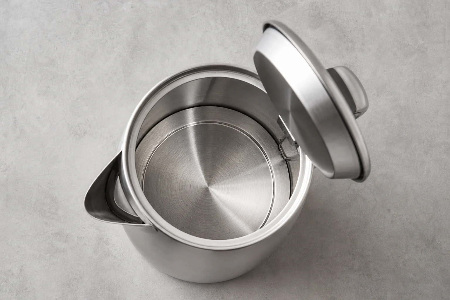 Stainless steel kettle interior showing food-grade metal construction without plastic components