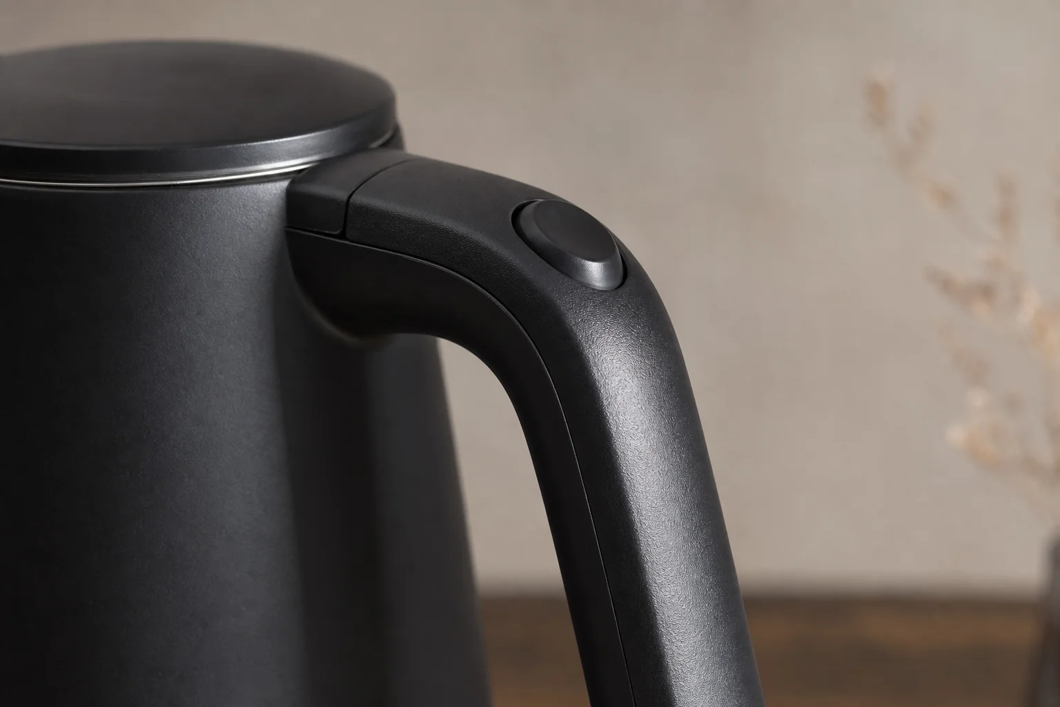 Ergonomic handle detail showing angled grip design and one-touch switch button