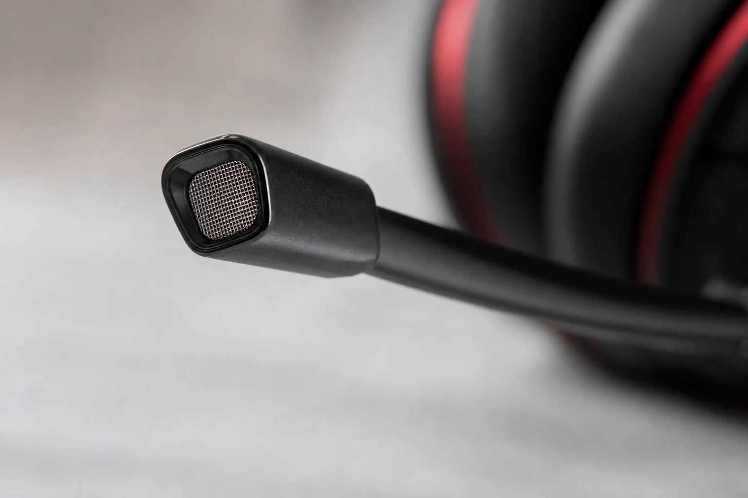 Close-up of gaming headset microphone with noise cancellation mesh