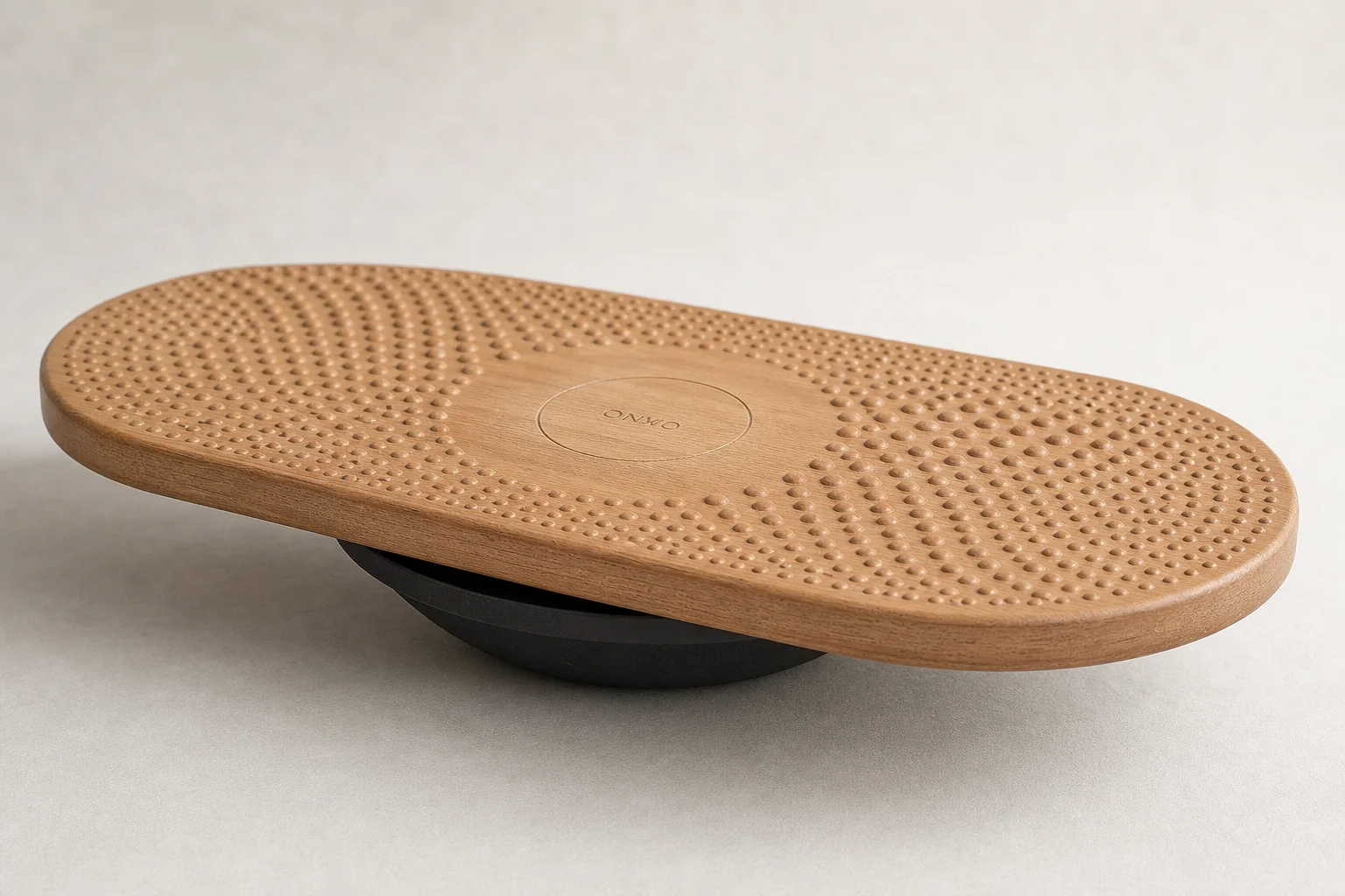 Five anti-fatigue mats and balance boards arranged on grey backdrop