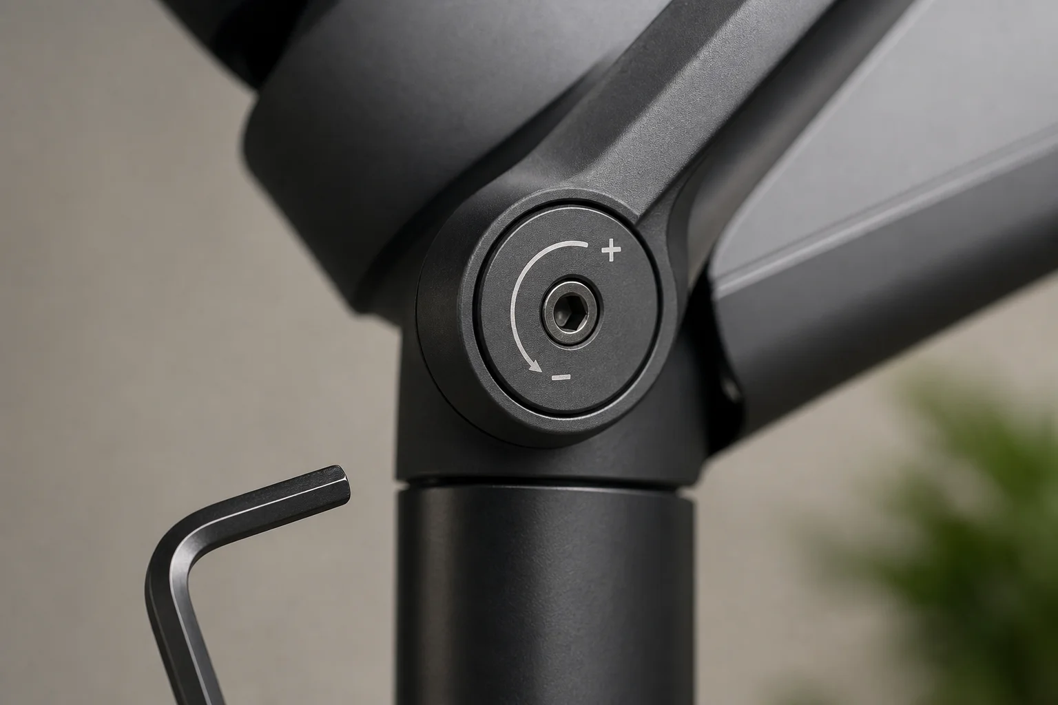 Close-up of gas spring tension adjustment mechanism with Allen key