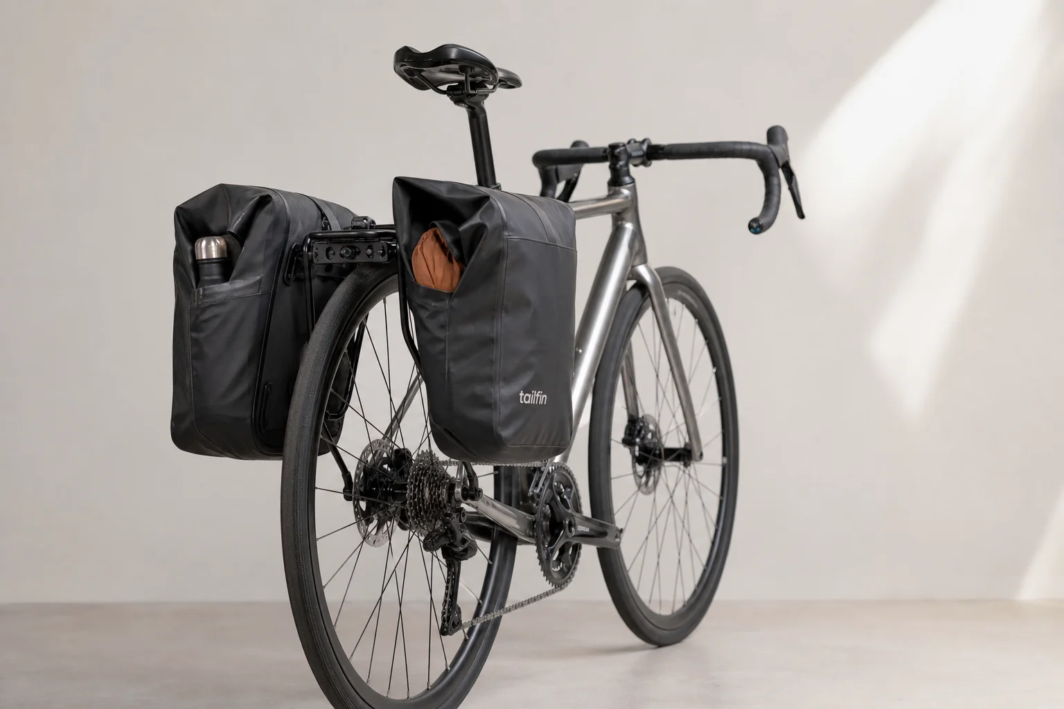 Tailfin Super Light Pannier bags mounted on a road bike rear cargo system