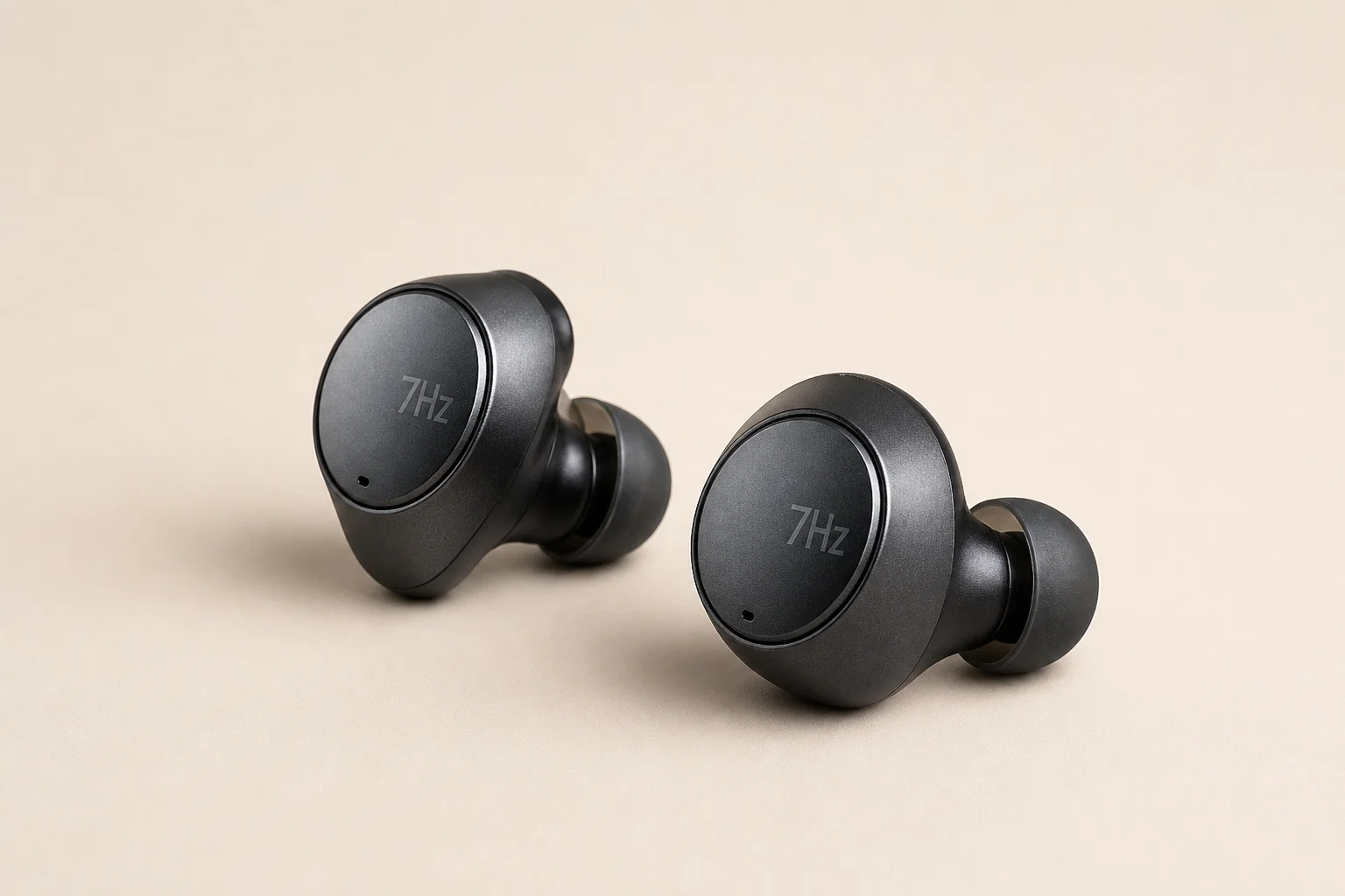 Nine earbud models arranged on concrete surface representing budget to premium options
