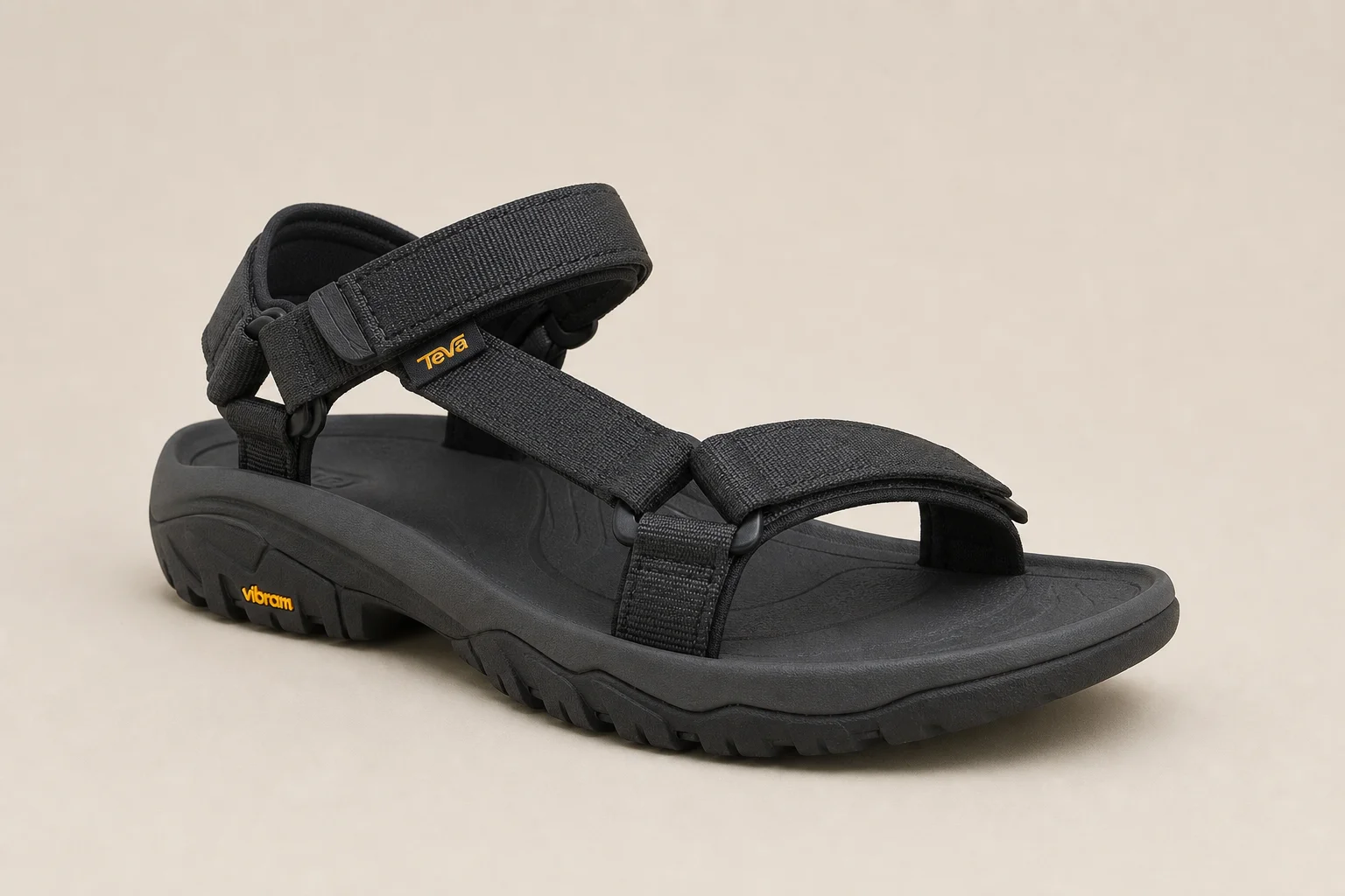 Five hiking sandals arranged on concrete surface representing different styles and protection levels