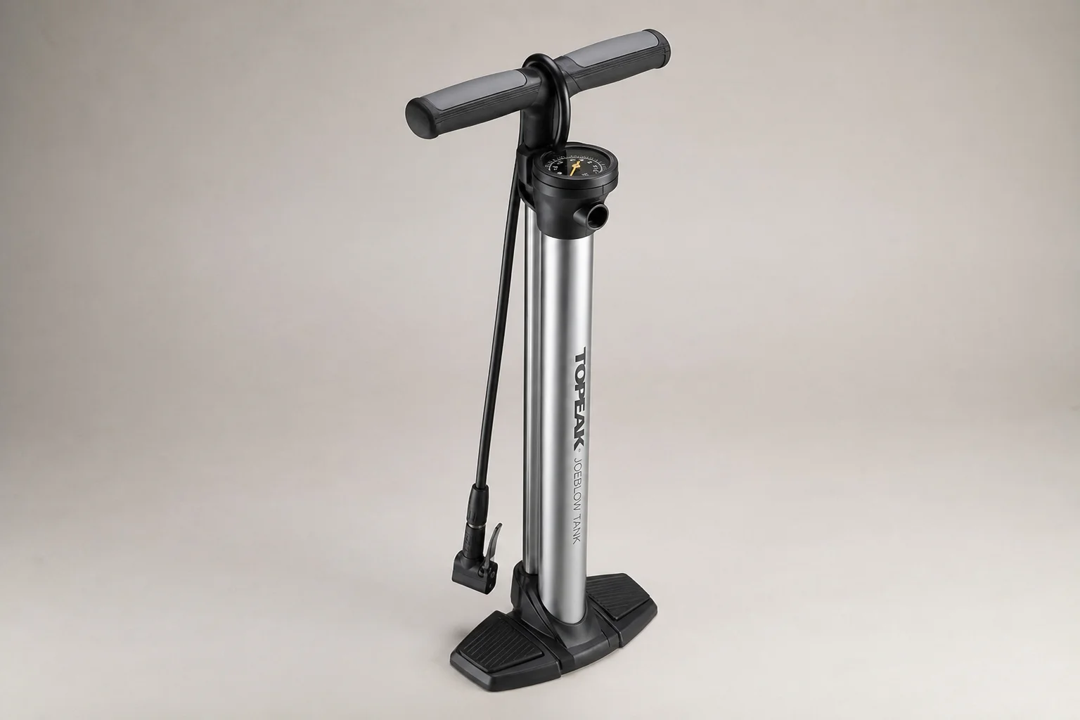 Five bike pumps displayed on concrete surface in staggered arrangement