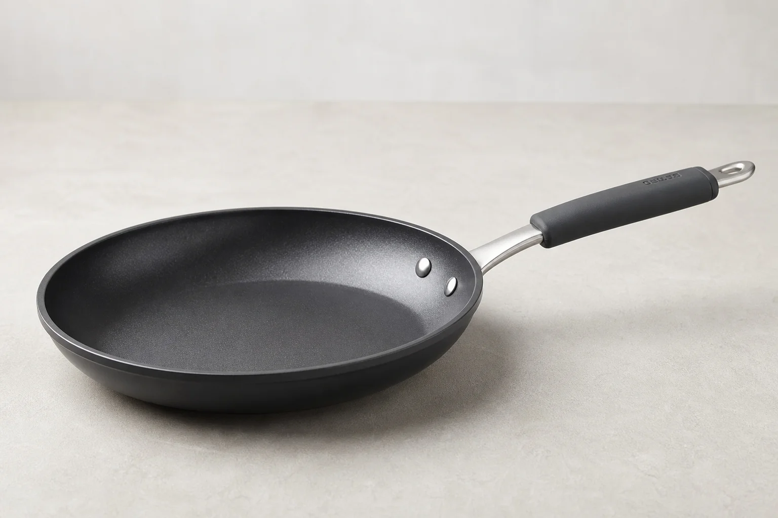 Collection of budget cookware including stainless steel, cast iron, non-stick, and enameled pans
