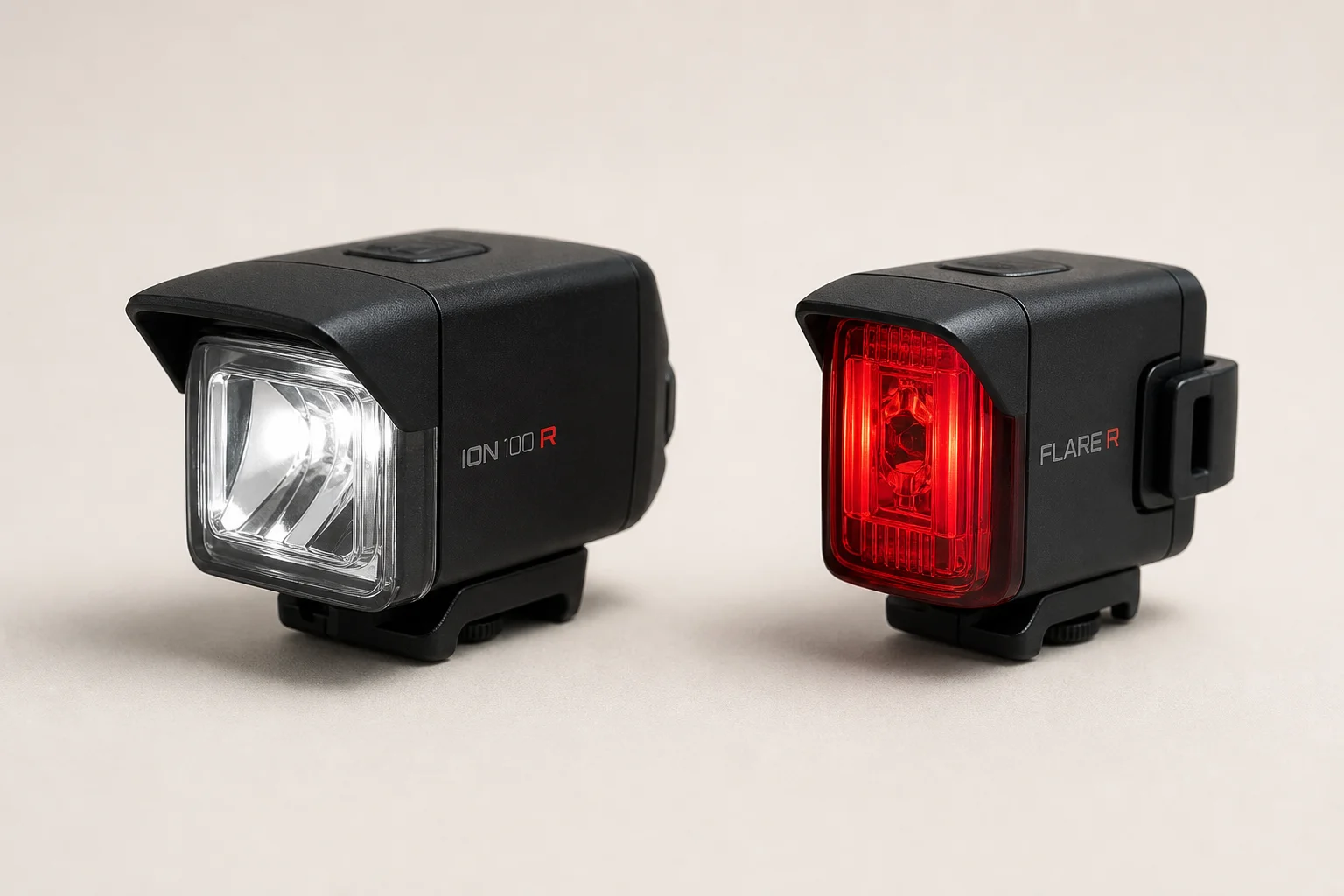 Trek Ion 100 R headlight and Flare R tail light side by side on neutral backdrop