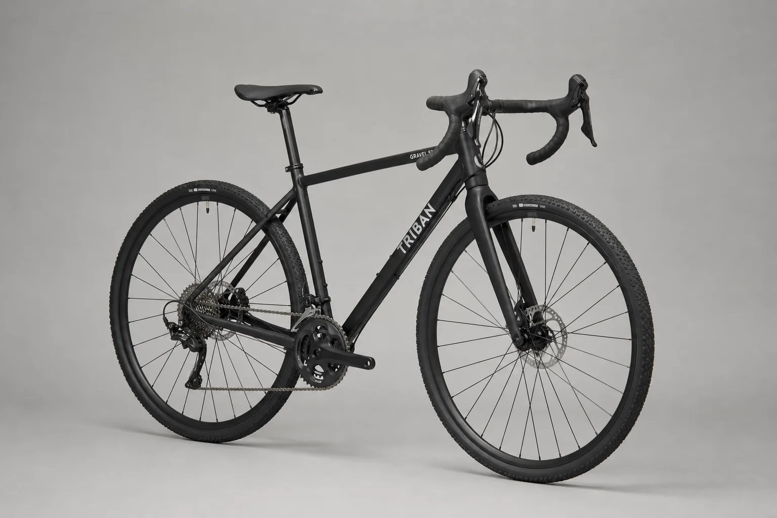 Five gravel bikes arranged in staggered composition showing different frame styles and geometries