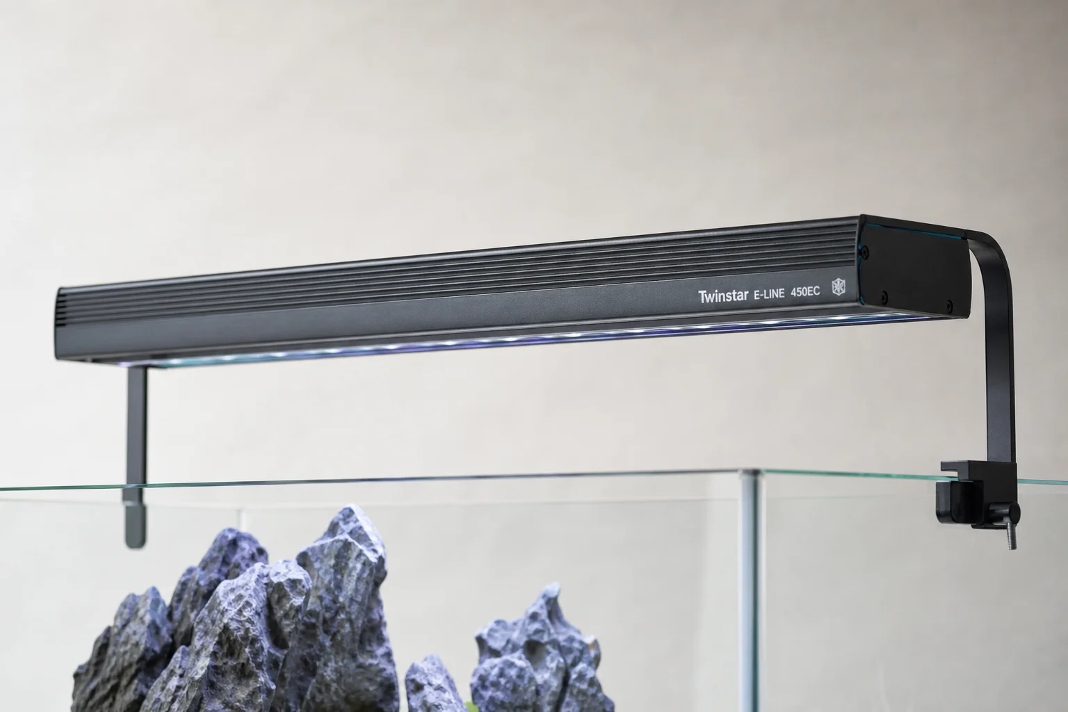 Aquascaping equipment including tanks, filters, lights, heater, and CO2 regulator on grey surface