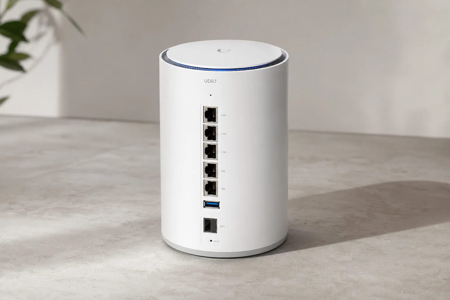 Ubiquiti UDR7 Dream Router with cylindrical white form factor on concrete surface