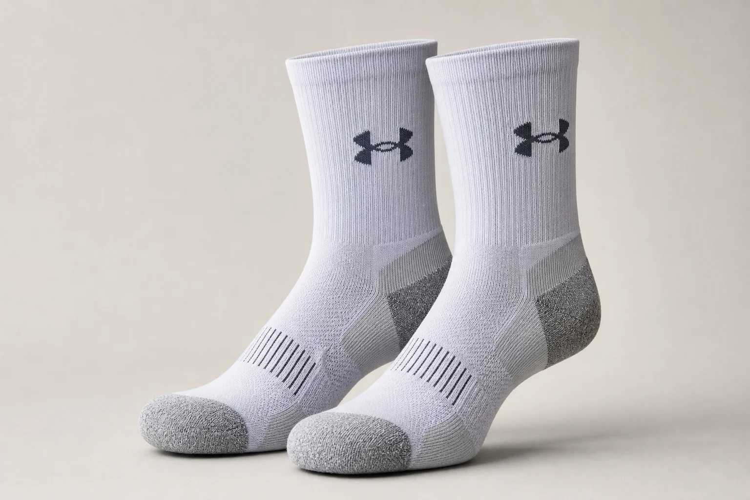 Collection of various running socks in different colors and styles on neutral backdrop