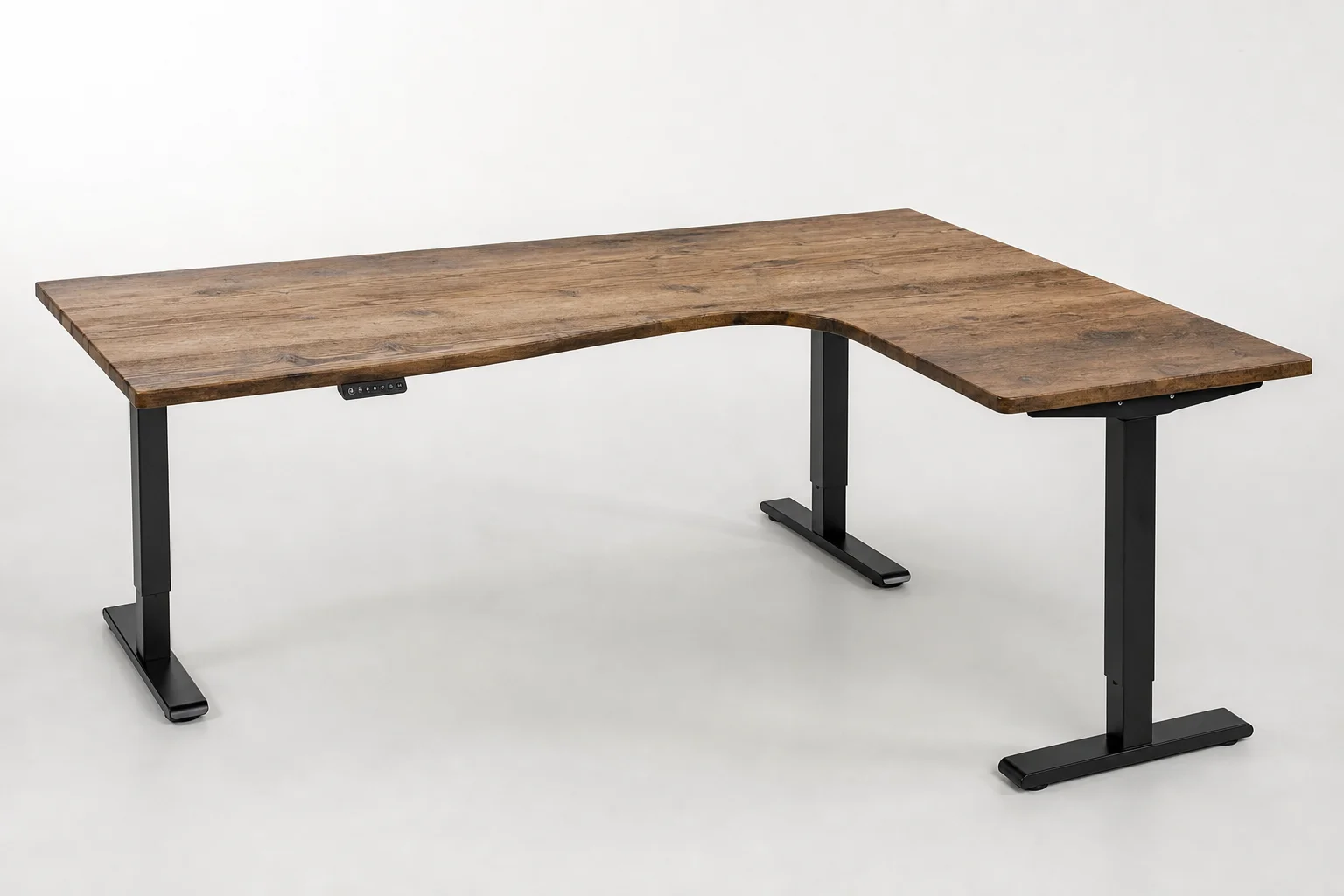 Vari L-shaped electric standing desk in reclaimed wood finish with curved front edge